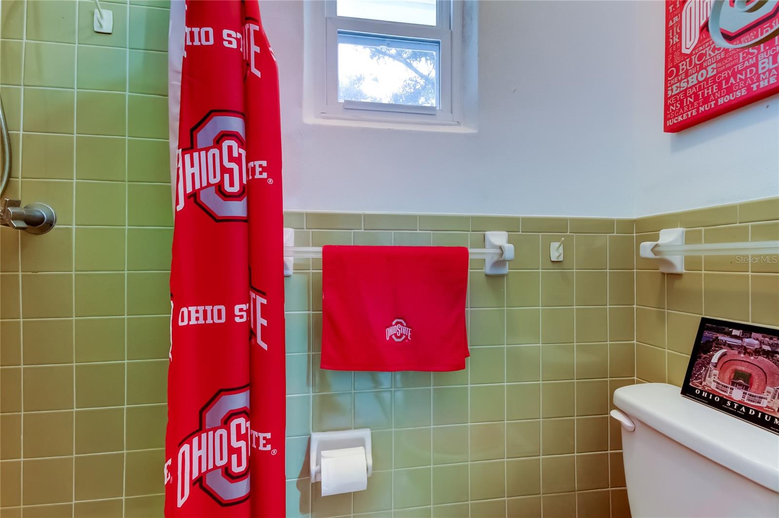 1/2 bath and showier in the garage. Easy to use from the pool.