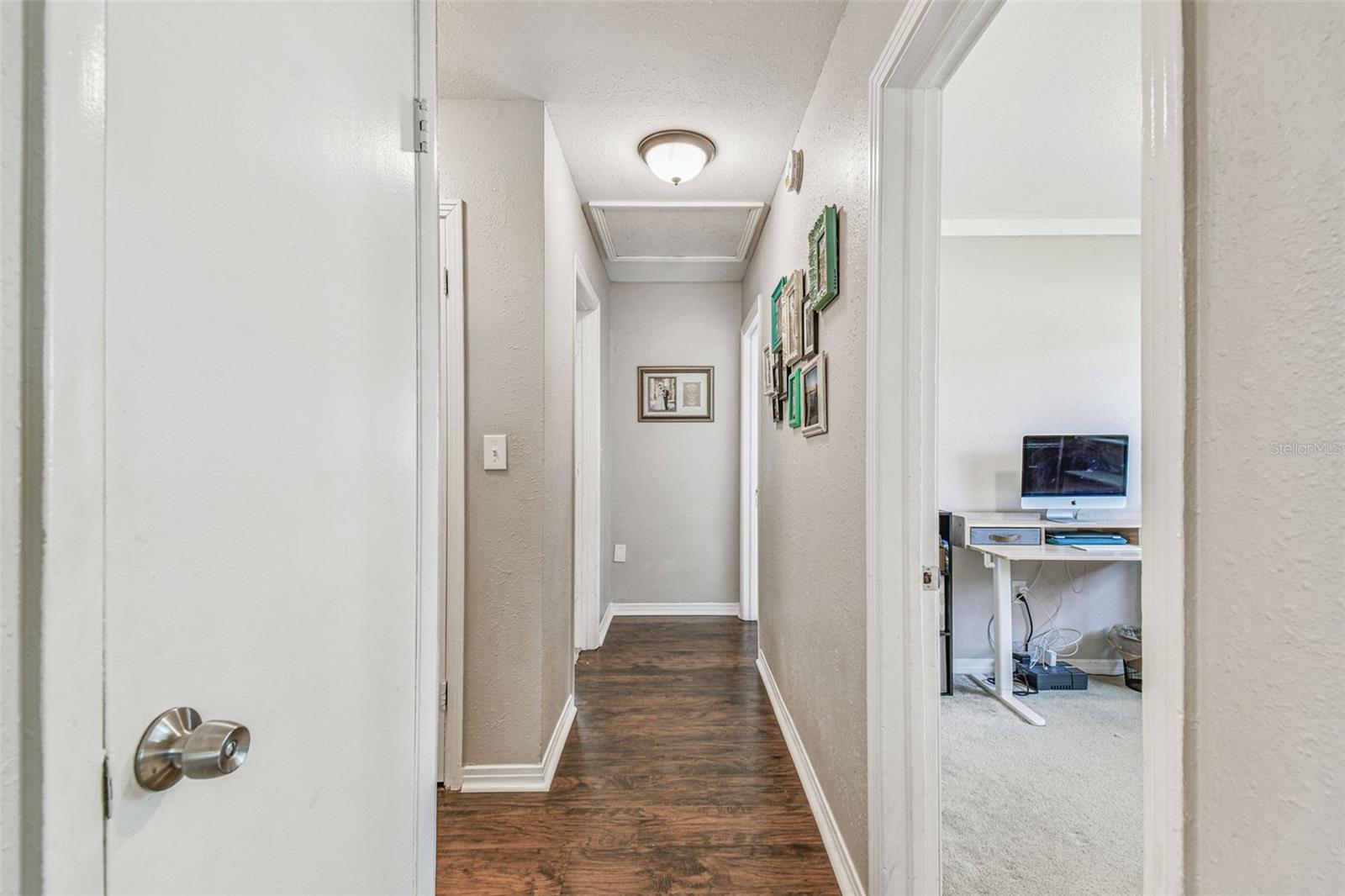 Hallway from the family room that leads to the guest wing of the home.