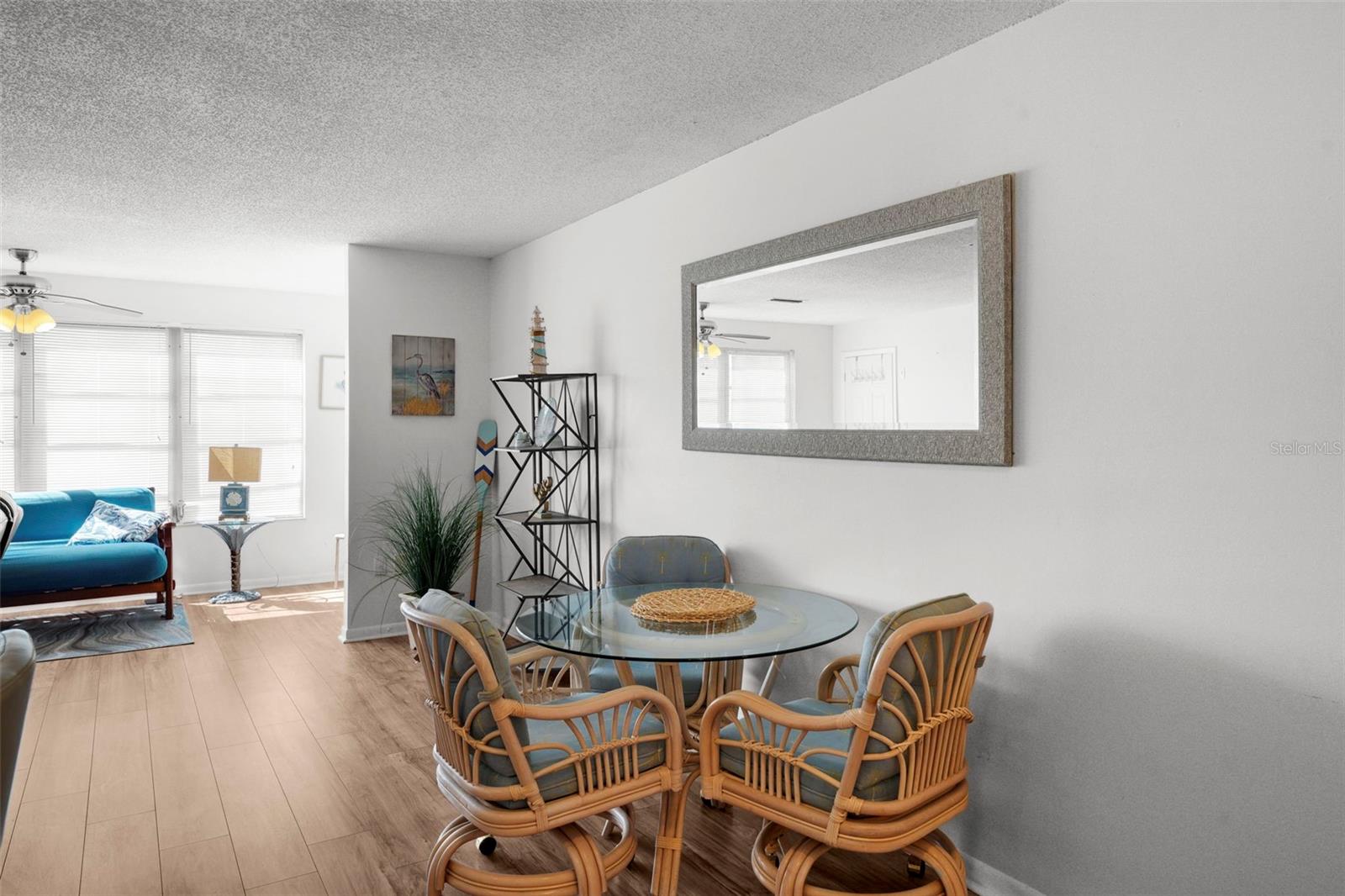 Cozy breakfast/dining nook with additional room on the wall to add a hutch, bar, or your own personal decor idea!