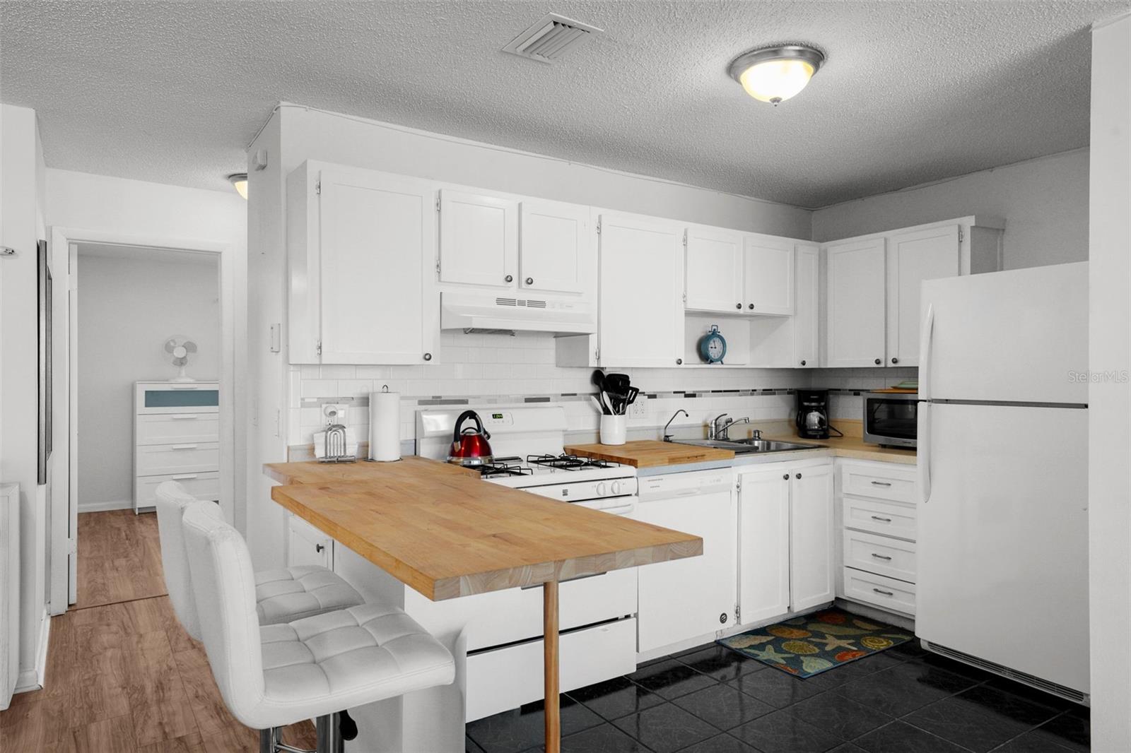 Wood block counters in the kitchen offer convenience for your cooking needs!