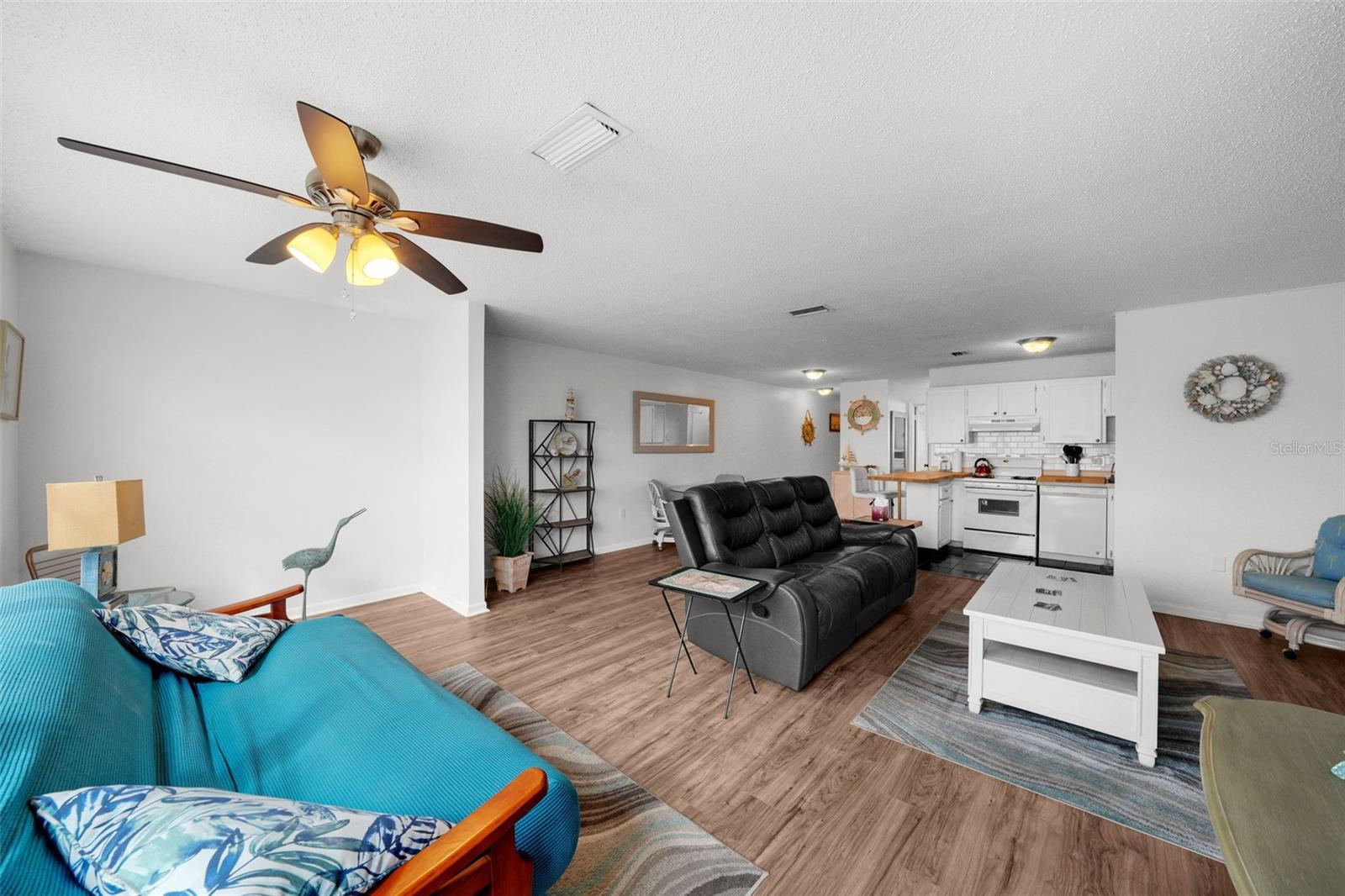Couch by the large window can be converted to an office desk/reading nook/sleeper sofa - again, so much flexibility!