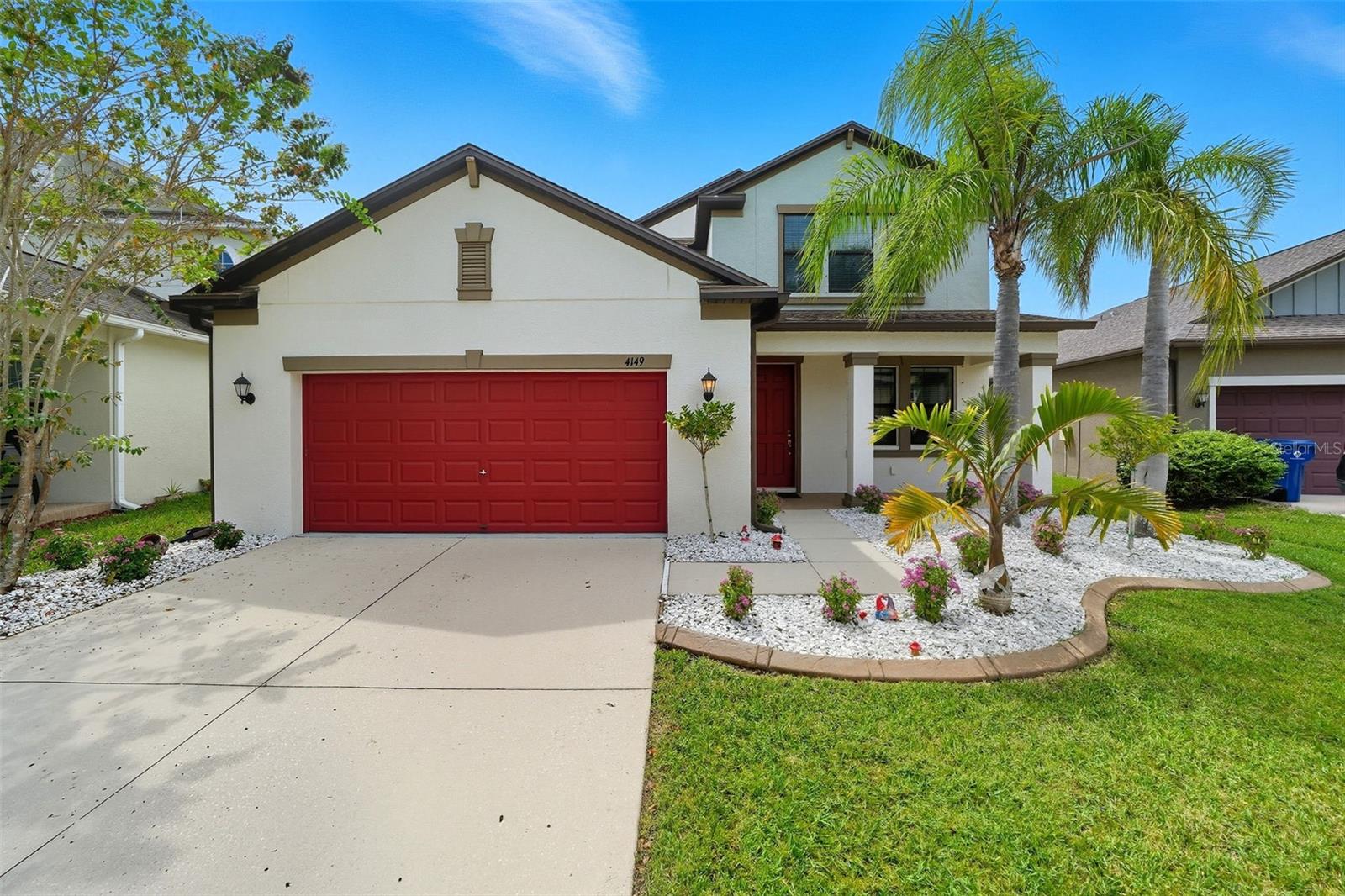 Gorgeous landscaping as you approach the home