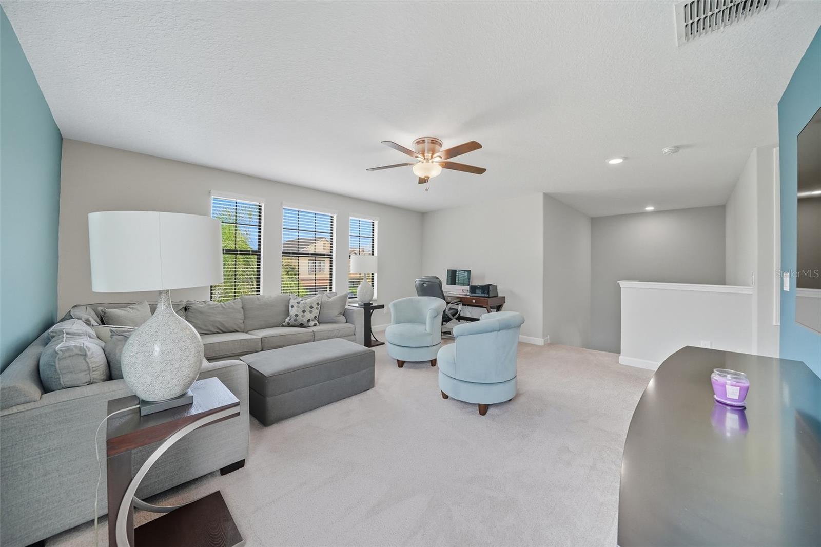Expansive upstairs loft with room for a sectional, desk, and more—perfect as a media room, playroom, or multipurpose family space