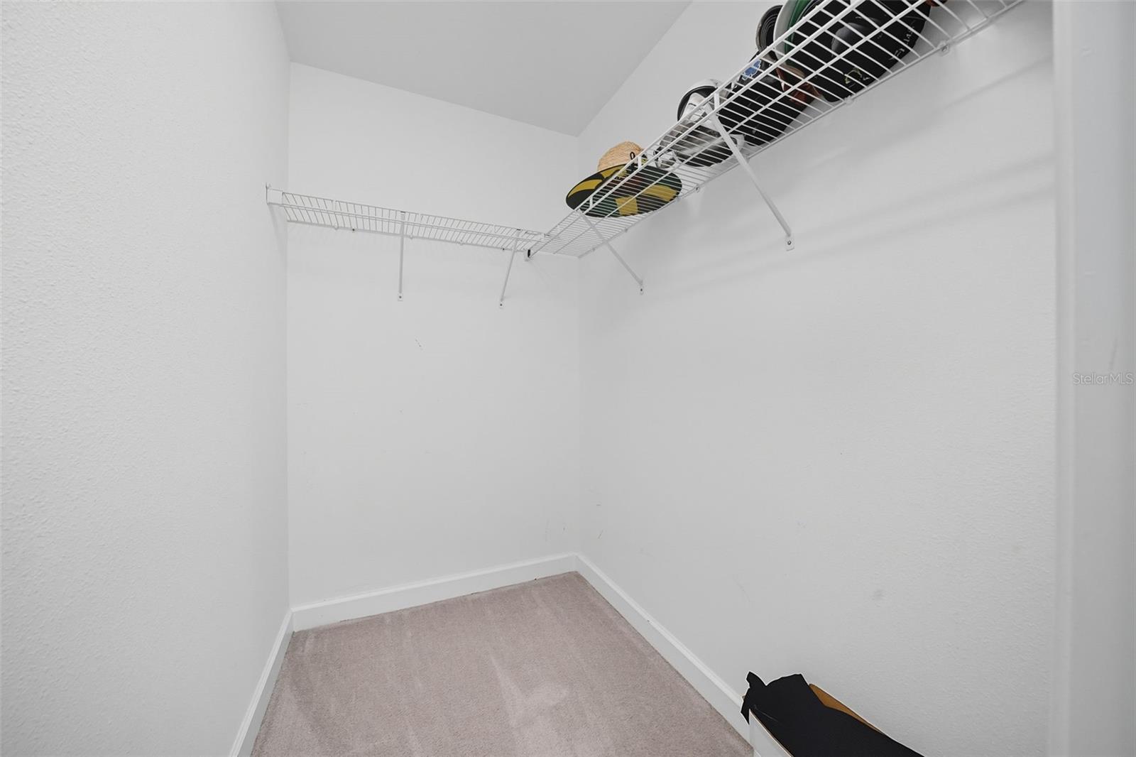 Generous walk-in closet located in the bedroom, providing ample storage and easy organization