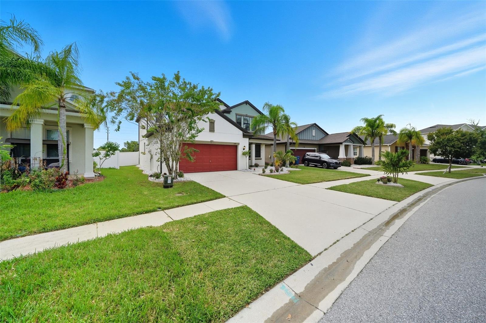 Located on a quiet, well-kept street lined with tropical landscaping and modern homes, this property offers fantastic curb appeal and a welcoming community fee