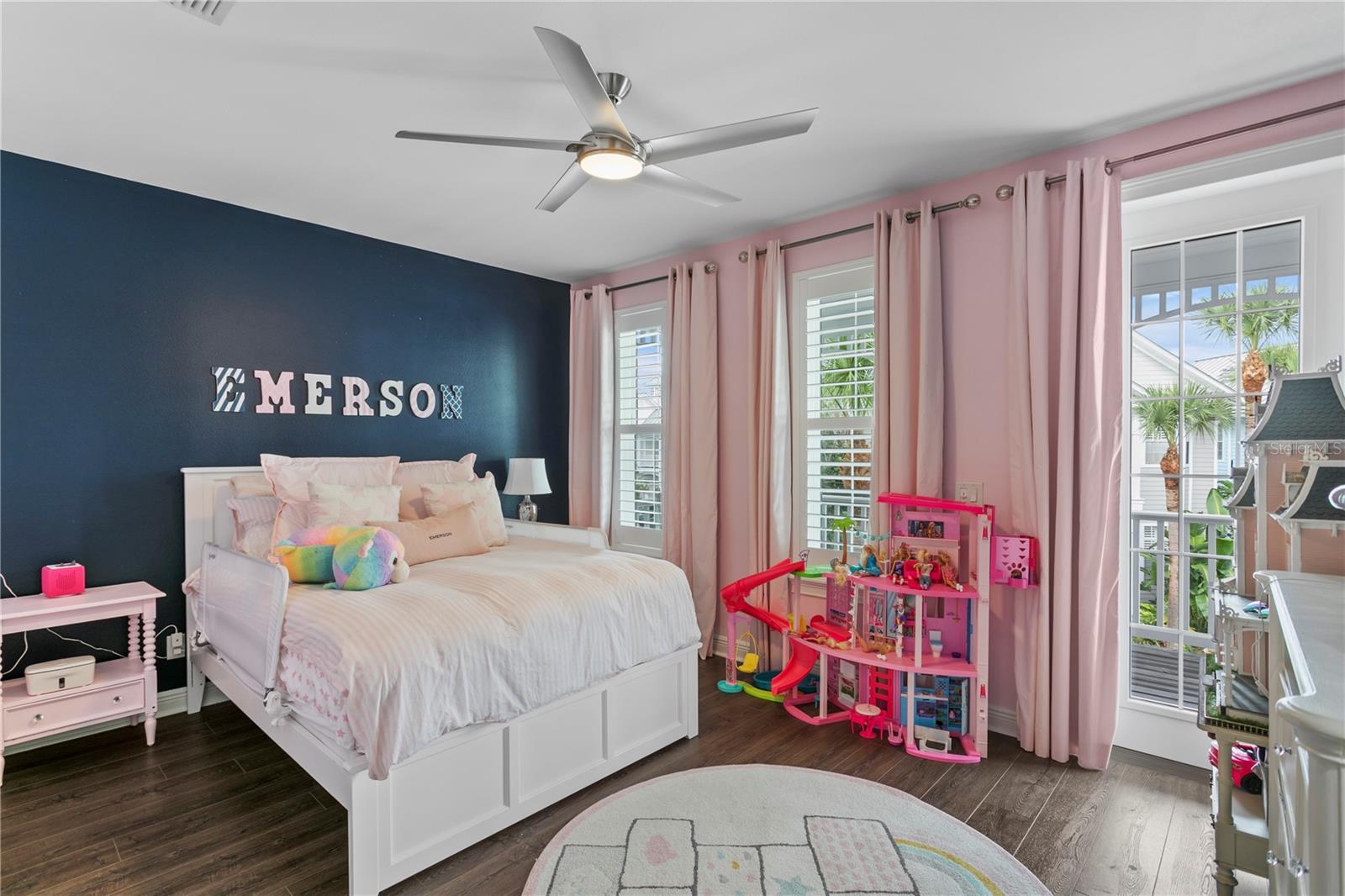 Bedroom 2 is spacious and has access to a private balcony