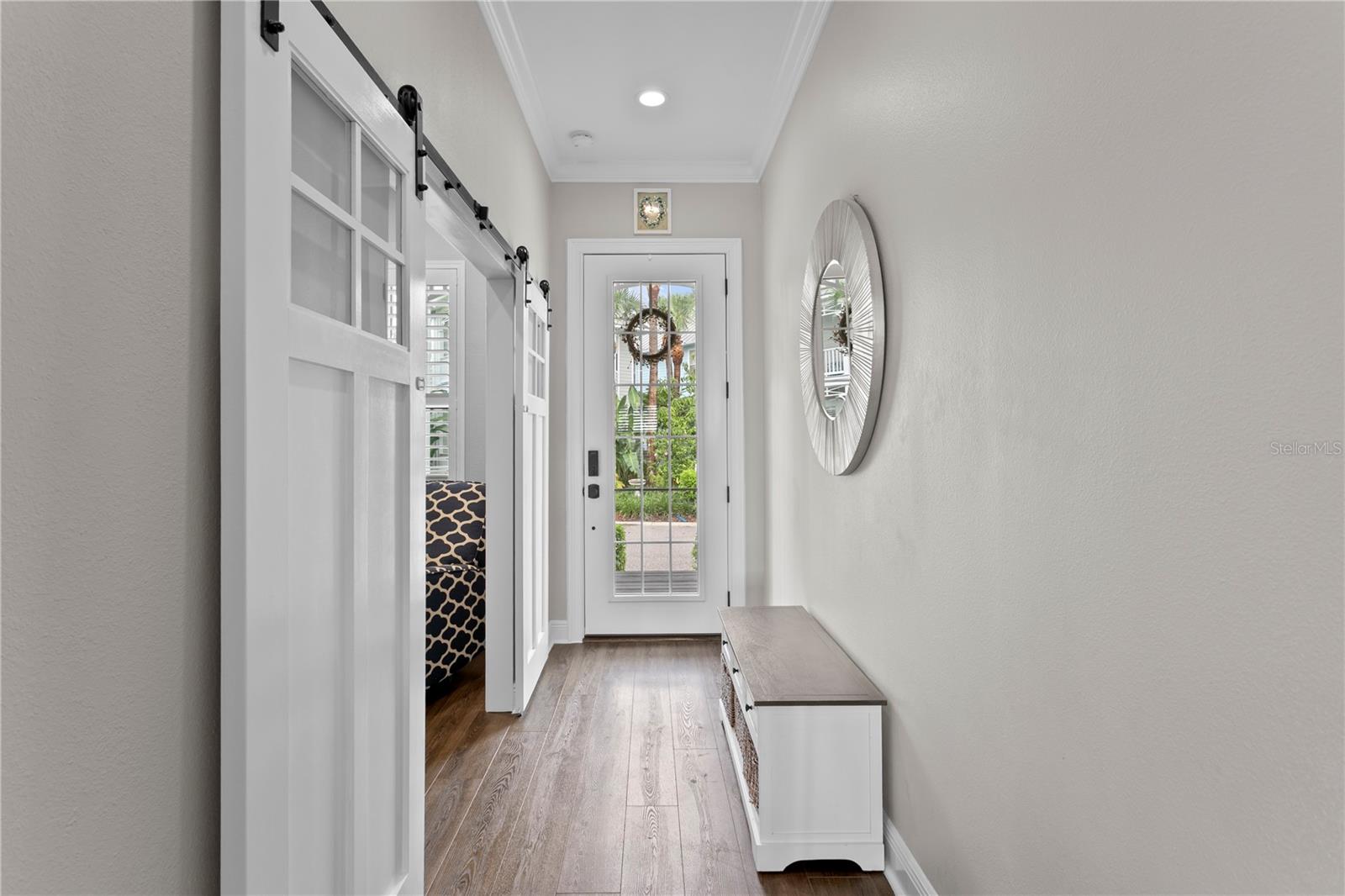 A center entry hall with large glass front door allows loads of natural light to fill the space