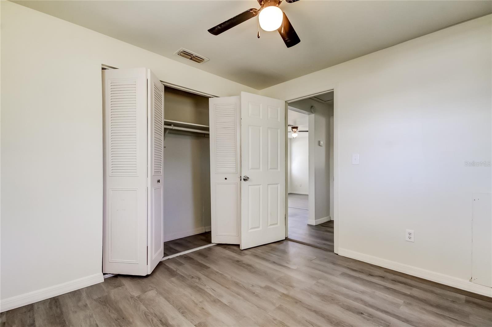 26. Primary Bedroom (10' x 10.2'). Updated Ceiling Fans to Keep Air Fresh and Moving!