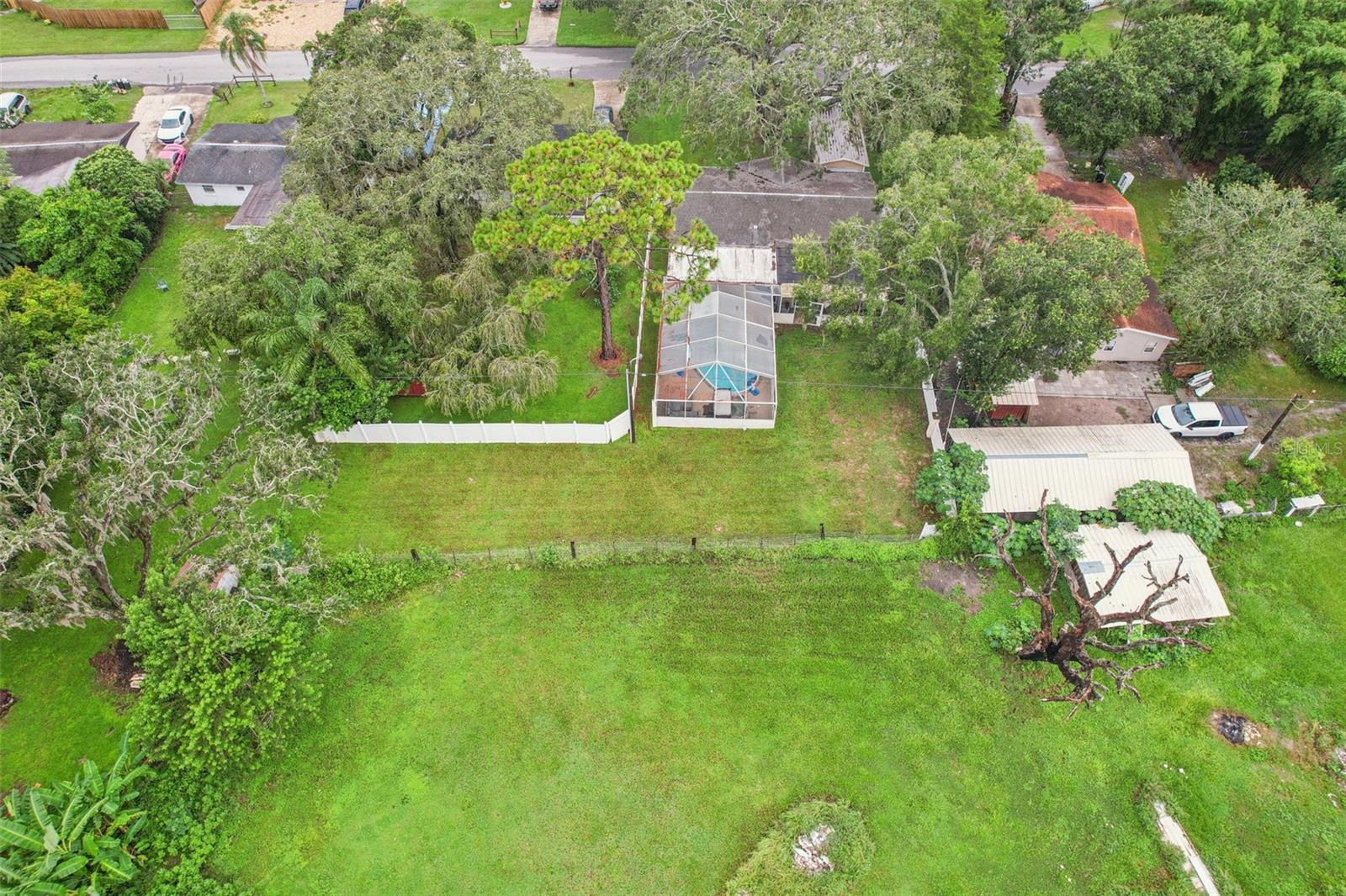 Huge lot/property includes area behind neighbors white fence-NO BACKYARD NEIGHBORS