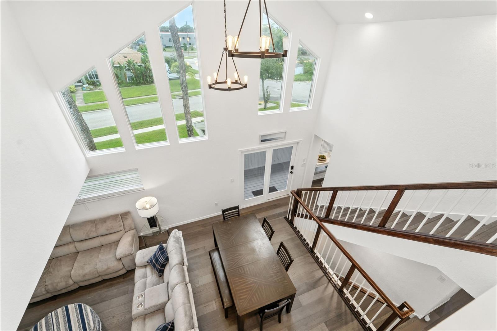 Soaring Vaulted Ceiling overlooking common area and french doors to lanai that could become new primary entrance.