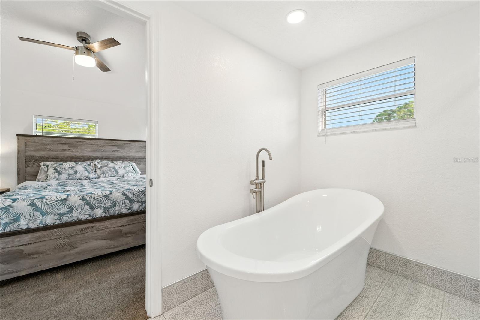 Large Standalone bath tub perfect for relaxing after a long day.
