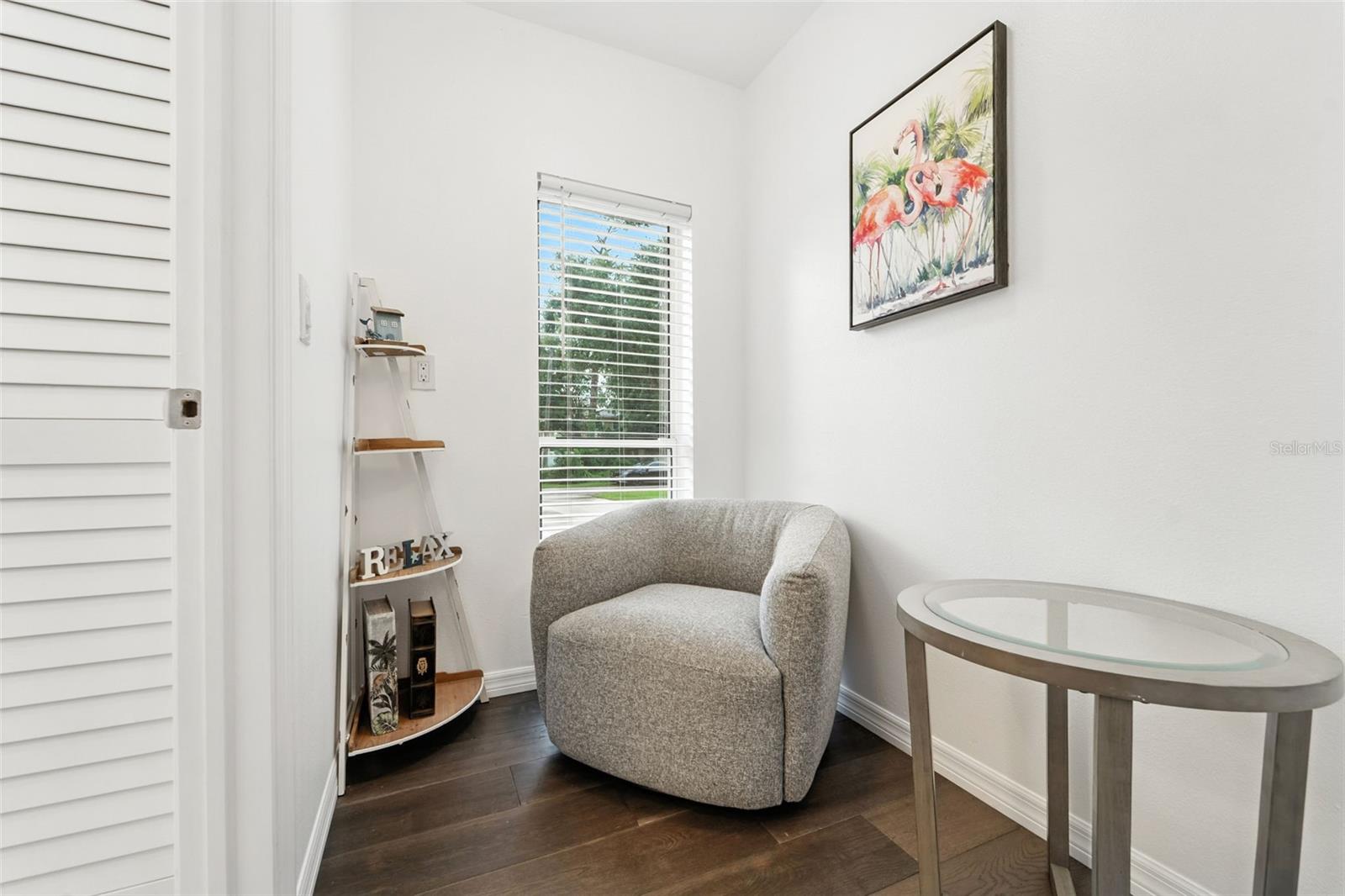 Flex reading area or office area. Could replace window with a door in the future to become new in-law/apartment entrance.