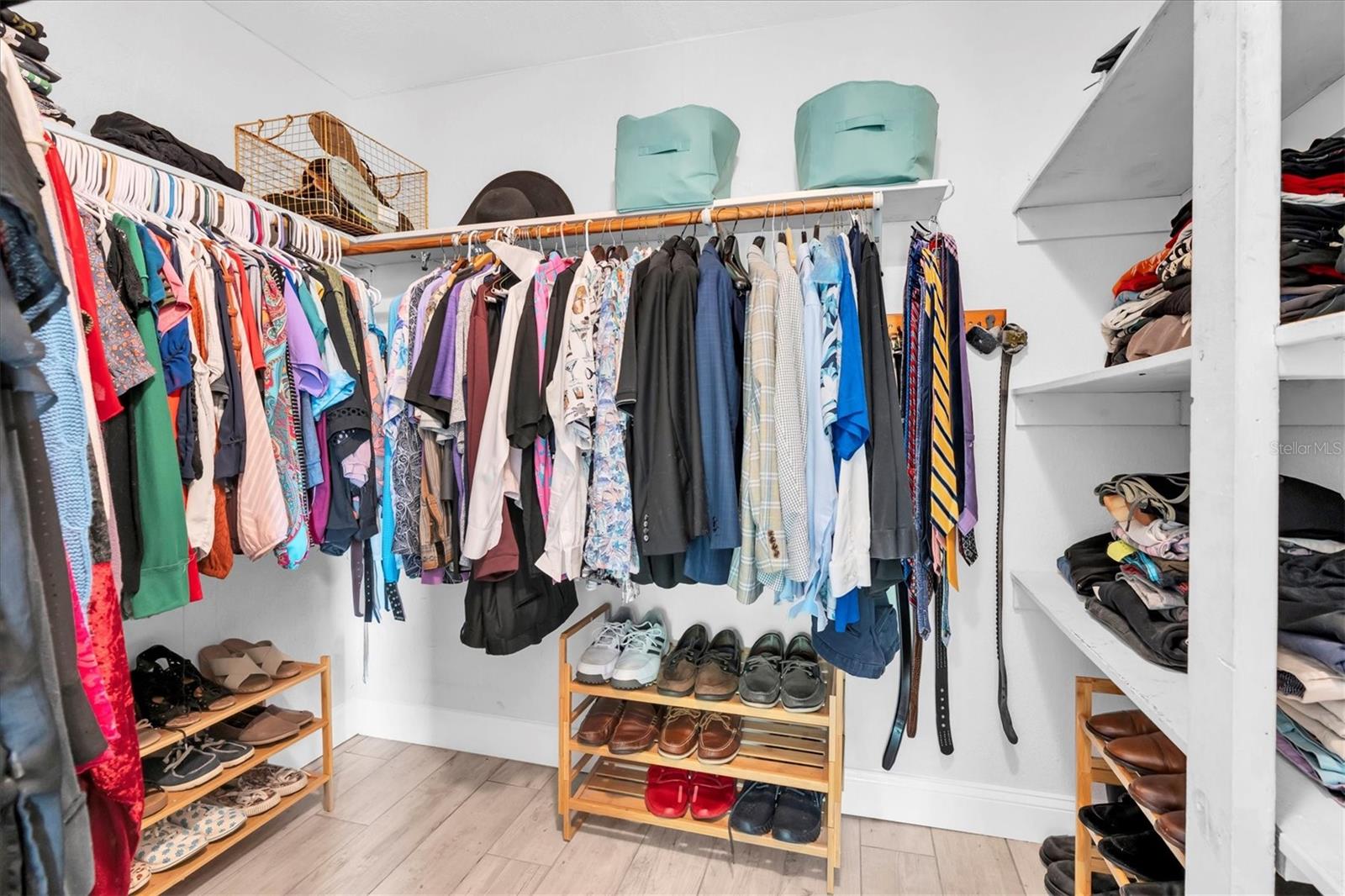 Huge walk in closet with built in shelves!
