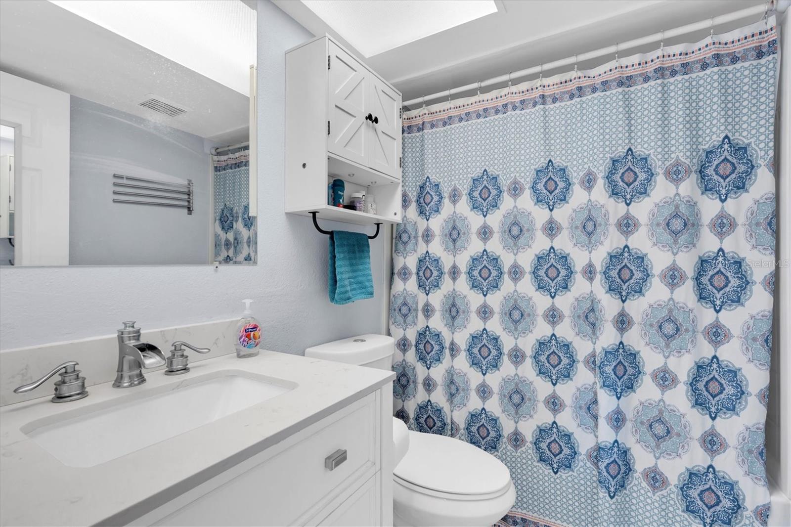 Hall bath - white and bright.
