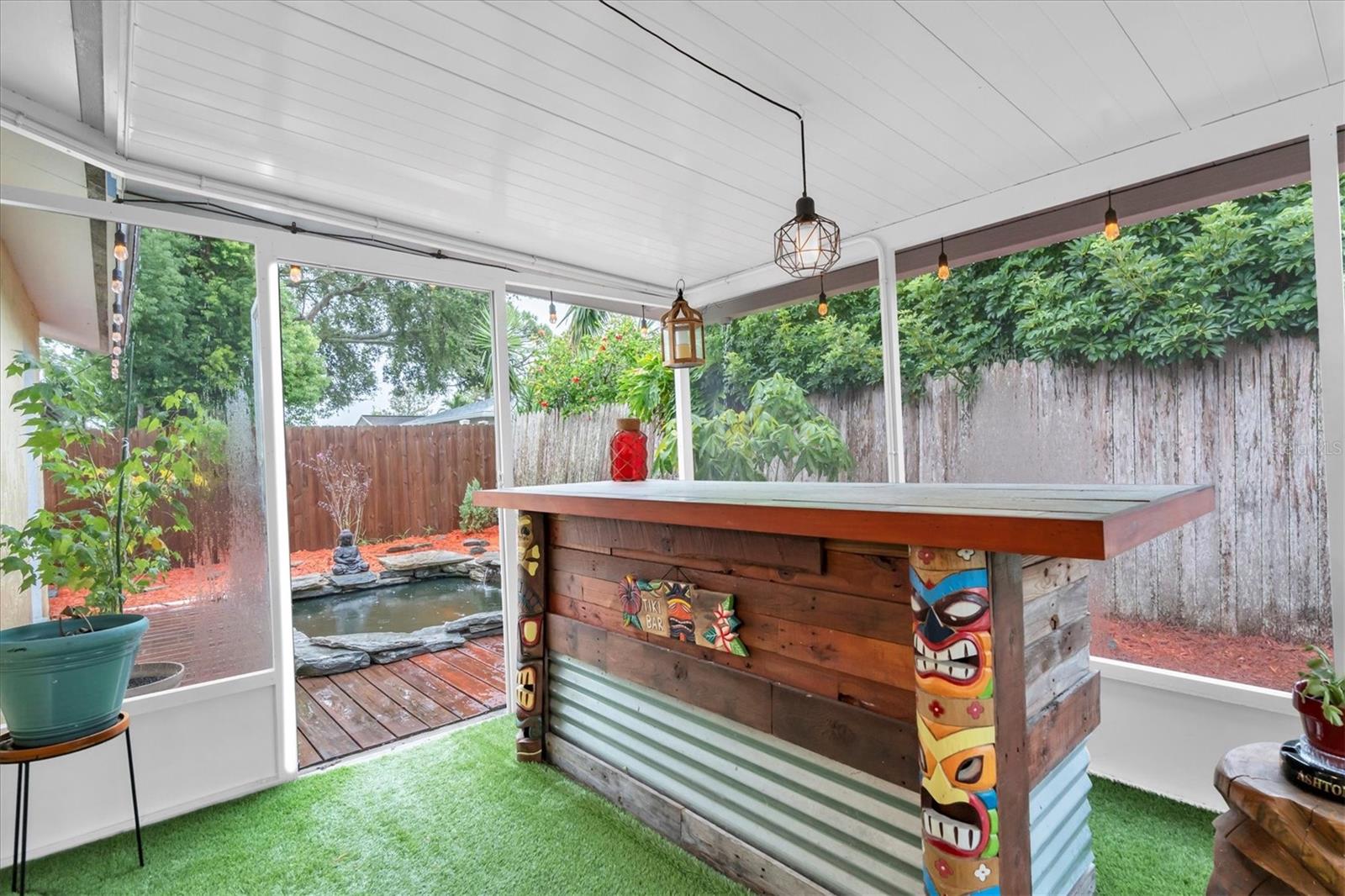 Large screened in porch, plenty of room for a bar and a seating area.