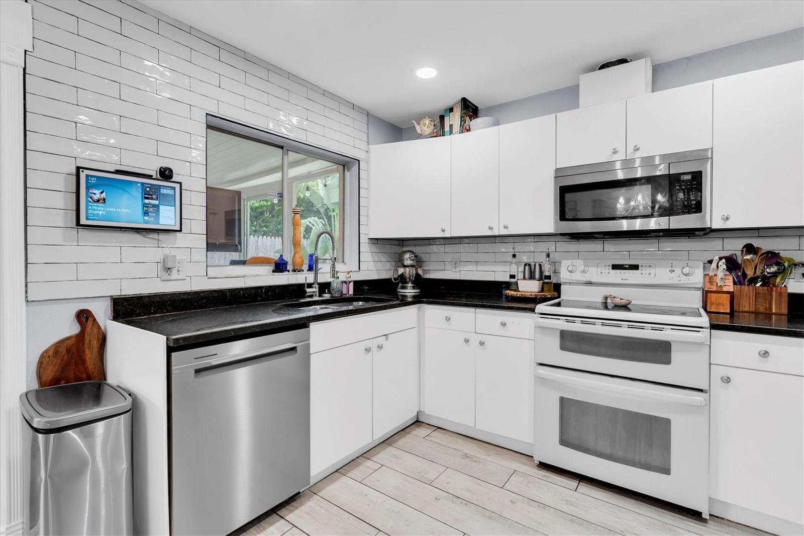 Subway tile backsplash and granite countertops for a completly clean look.