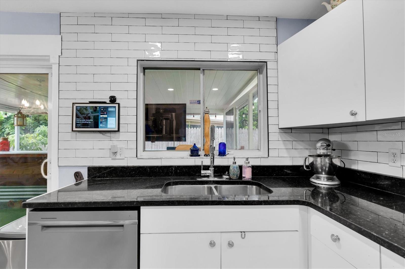 This window opens to the screened porch…great option for hosting parties or giving the kids a snack!