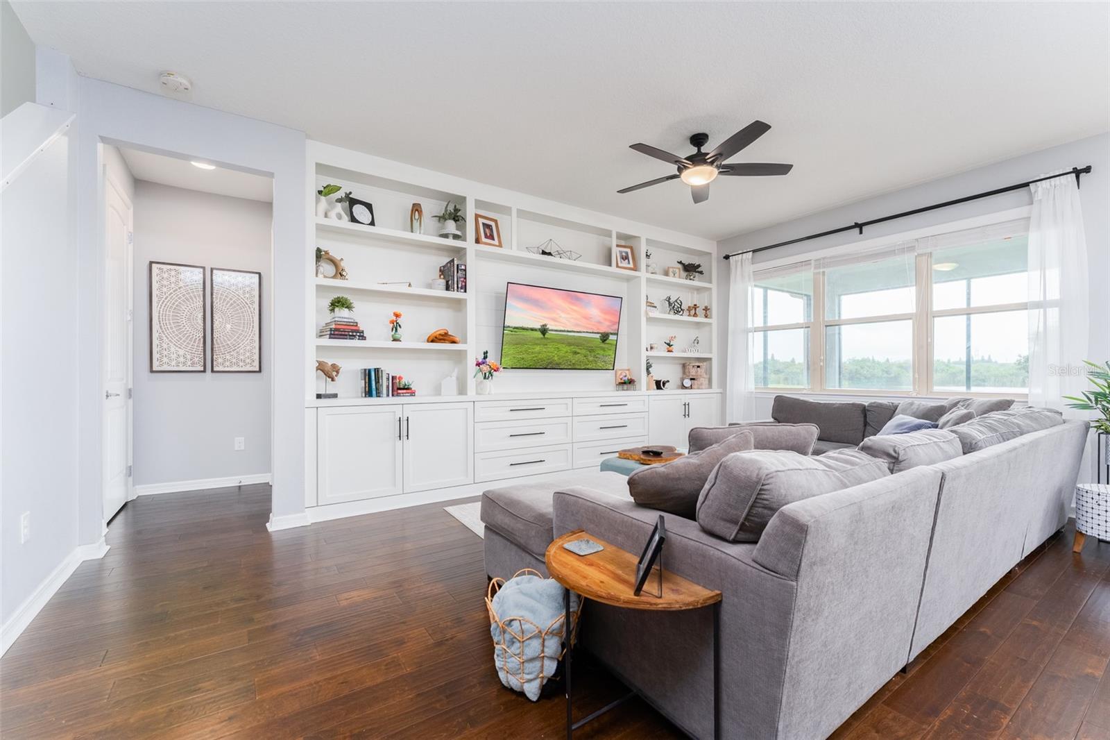 Spacious Living Room with Beautiful Built-in Wall Feature