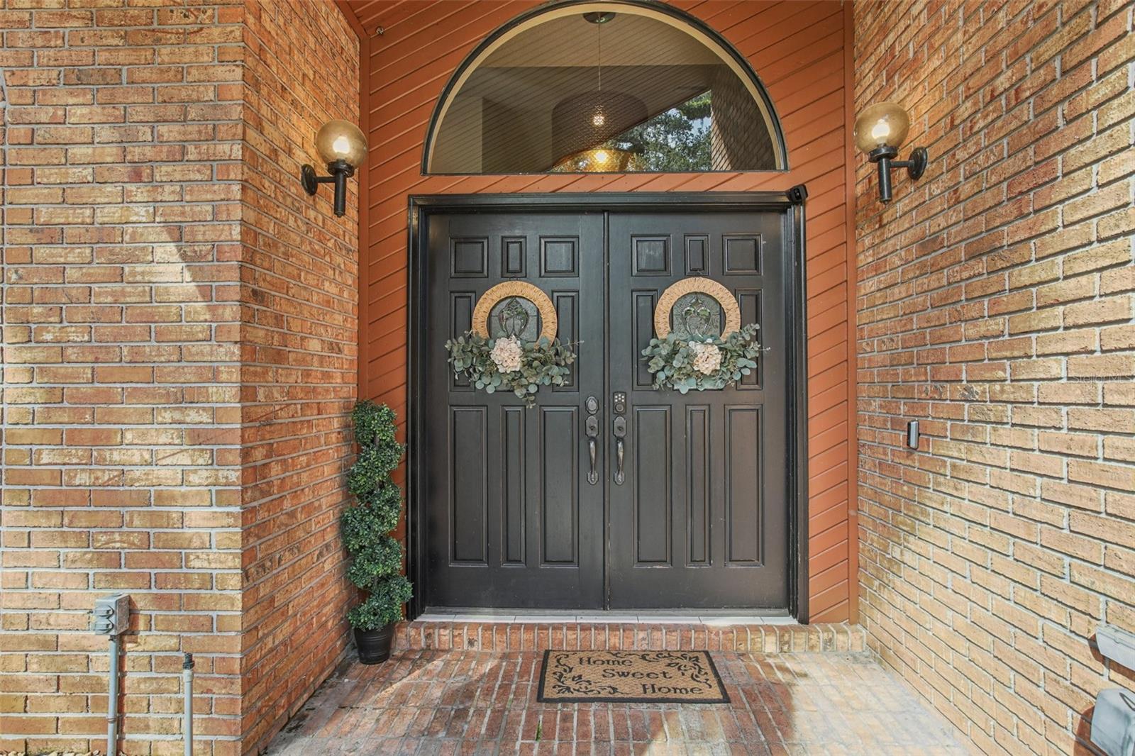 Entrance to home, with beautiful double doors