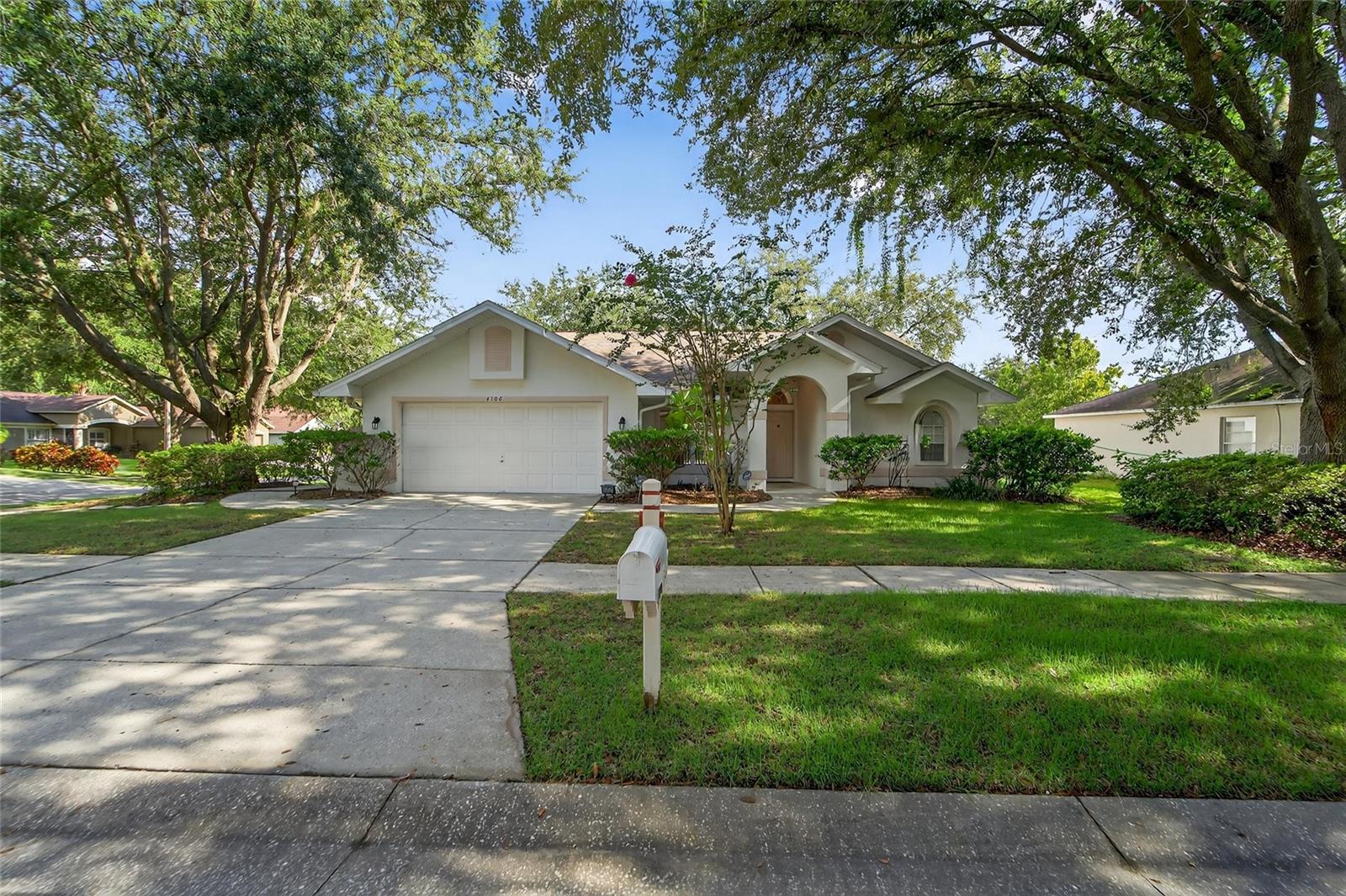 Fully manicured and landscaped front yard