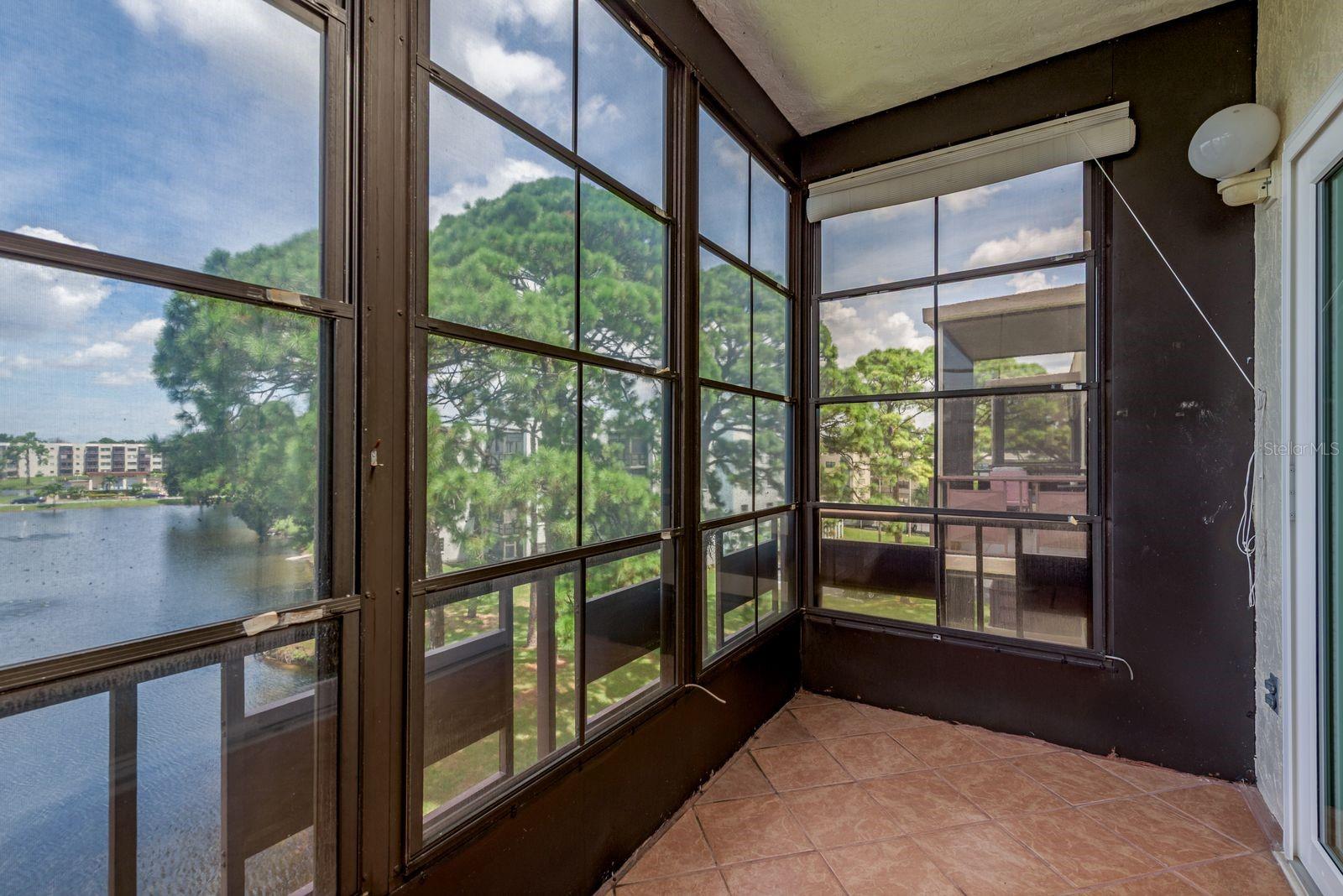 Enclosed Lanai overlooking pond