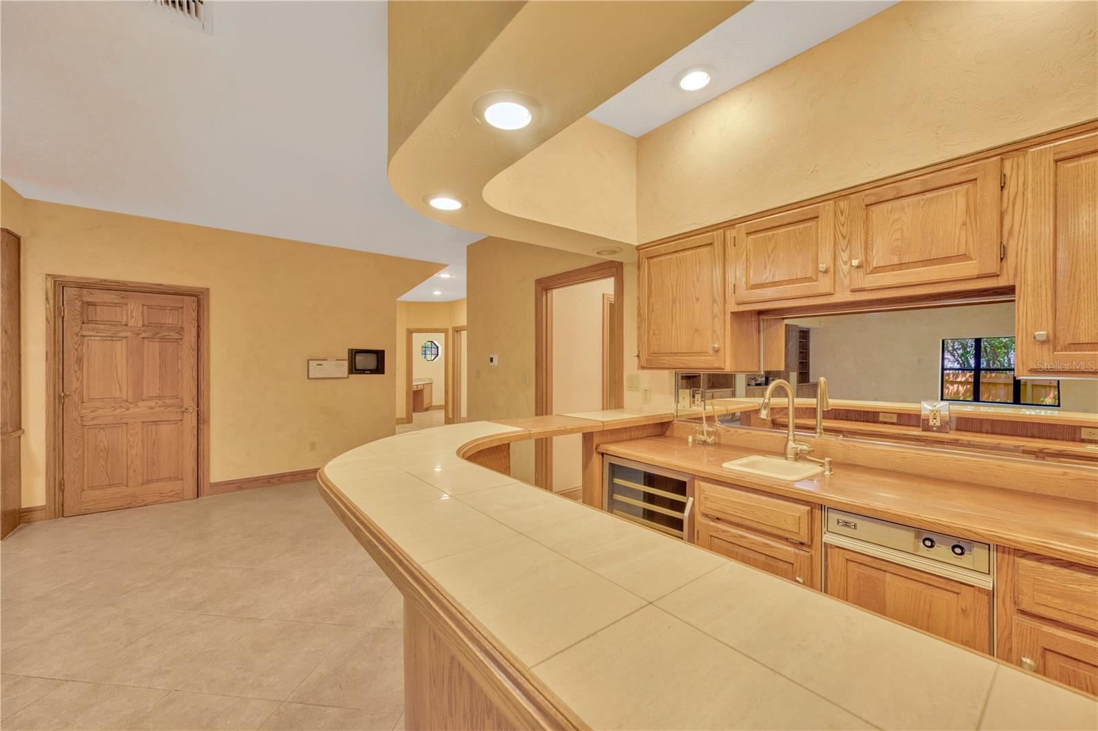 Wet bar with ice maker, sink, frig, blender built into the counter
