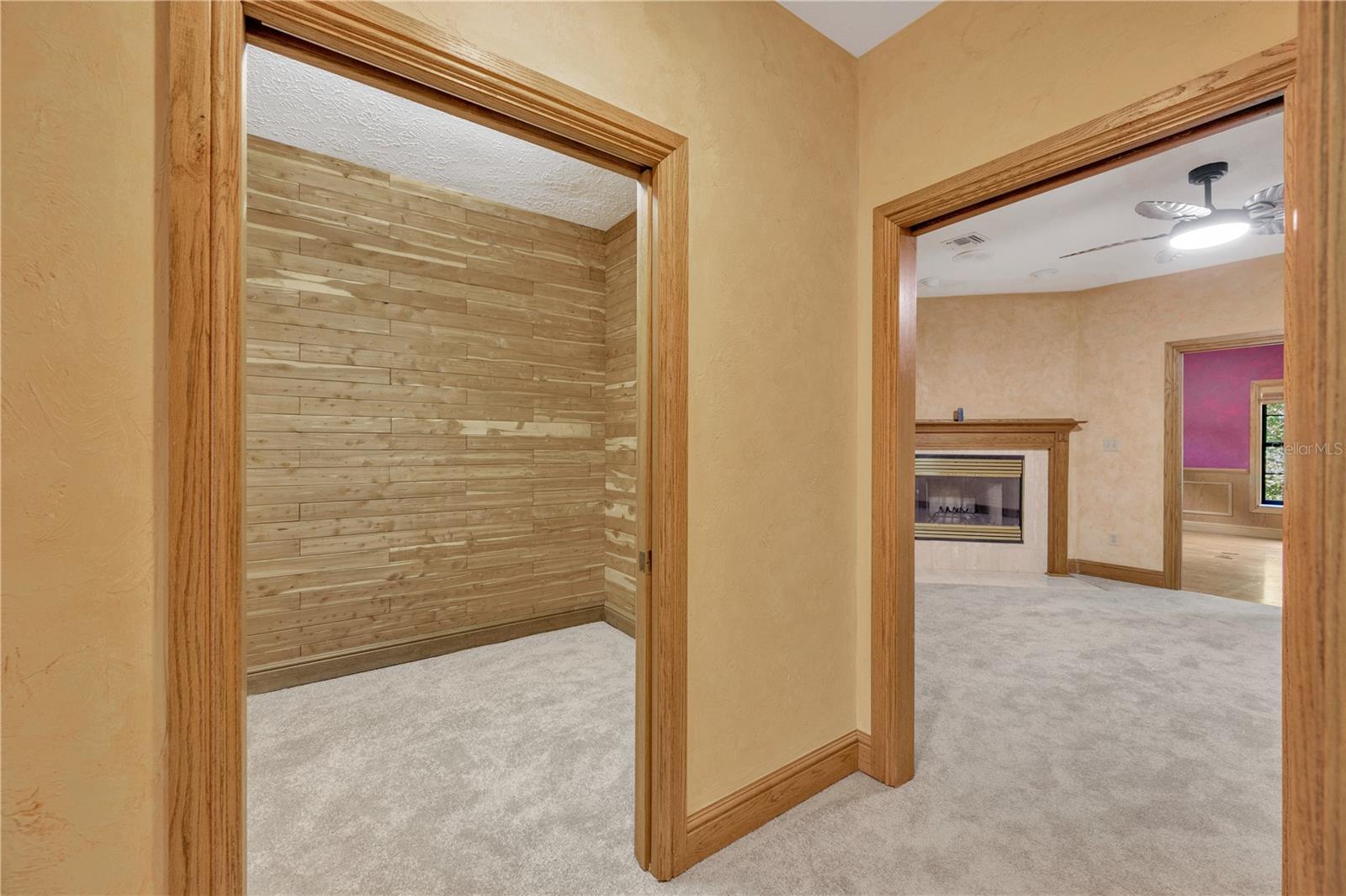 The owner’s suite has dual cedar-lined walk-in closets and connects to a flex room with its own fireplace—ideal as a private lounge, nursery, or 4th bedroom.