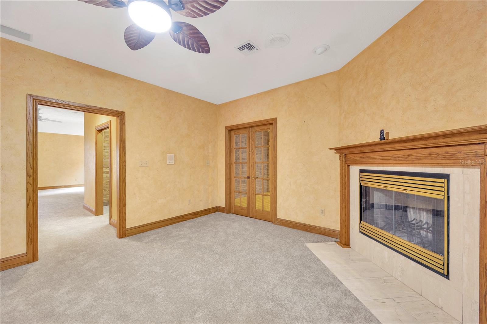 This flex room has a wood burning fireplace.