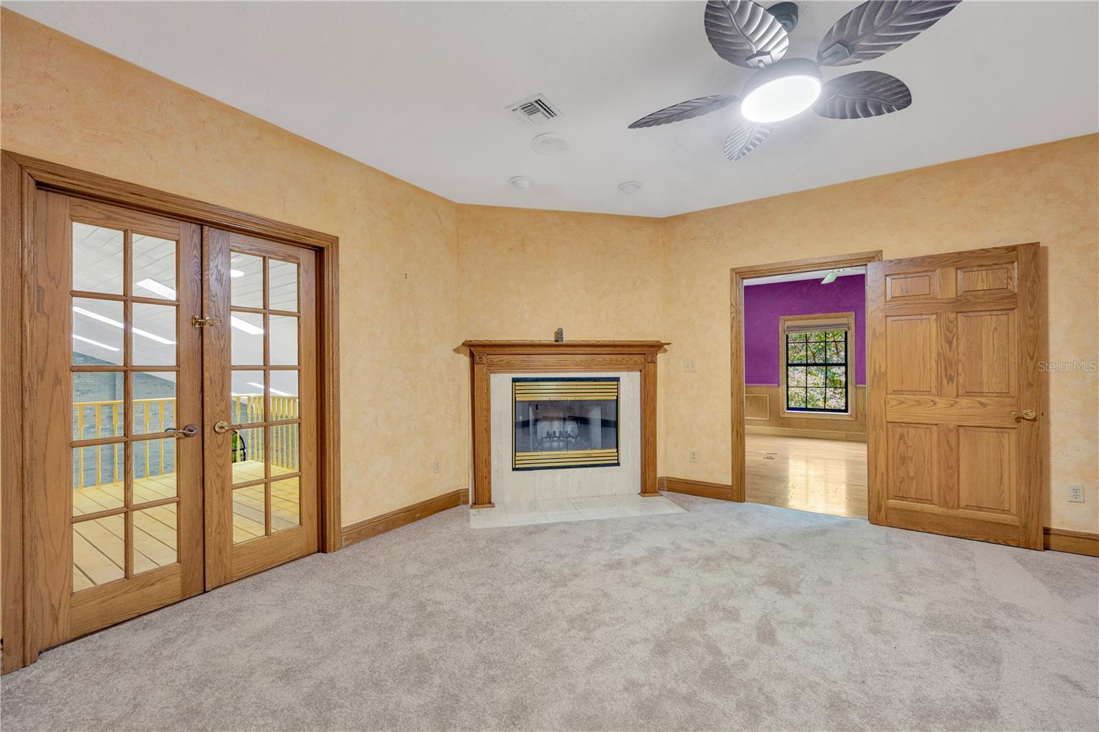 This flex room also has double glass doors lead to a balcony overlooking the pool/spa atrium below.