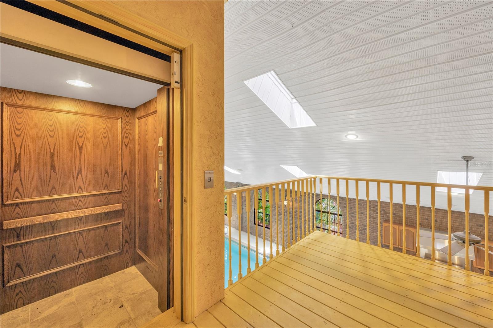 Elevator from 2nd floor balcony to first floor Atrium.