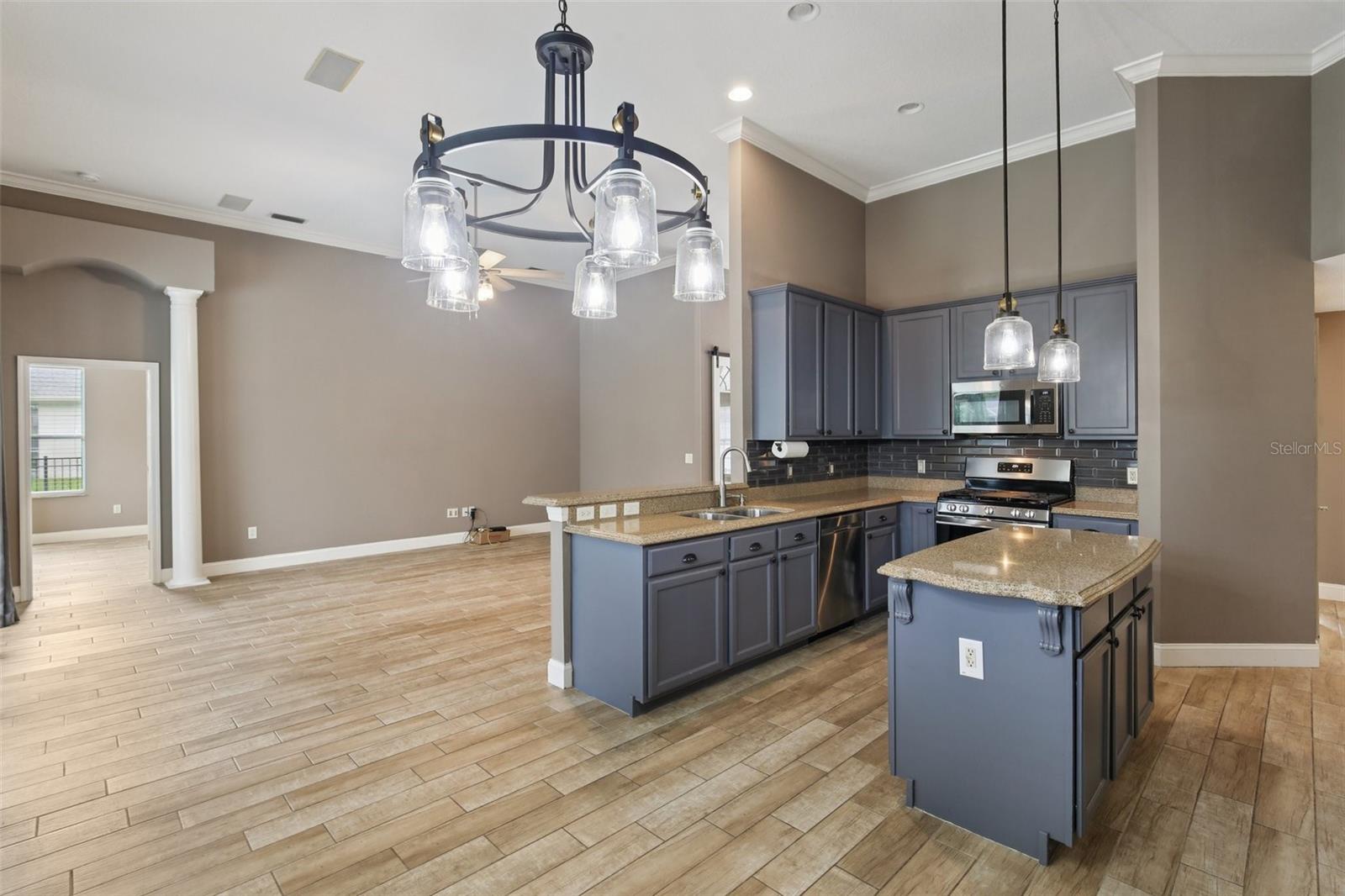 ISLAND IN THE GORGEOUS KITCHEN ADDS EXTRA WORK SPACE!