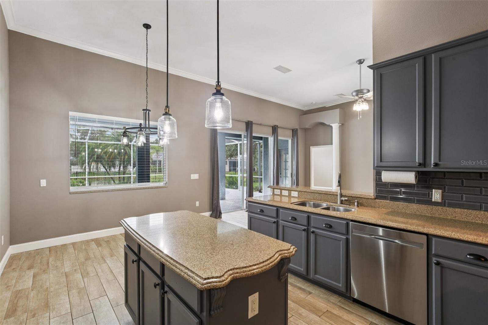 ISLAND IN THE GORGEOUS KITCHEN ADDS EXTRA WORK SPACE!