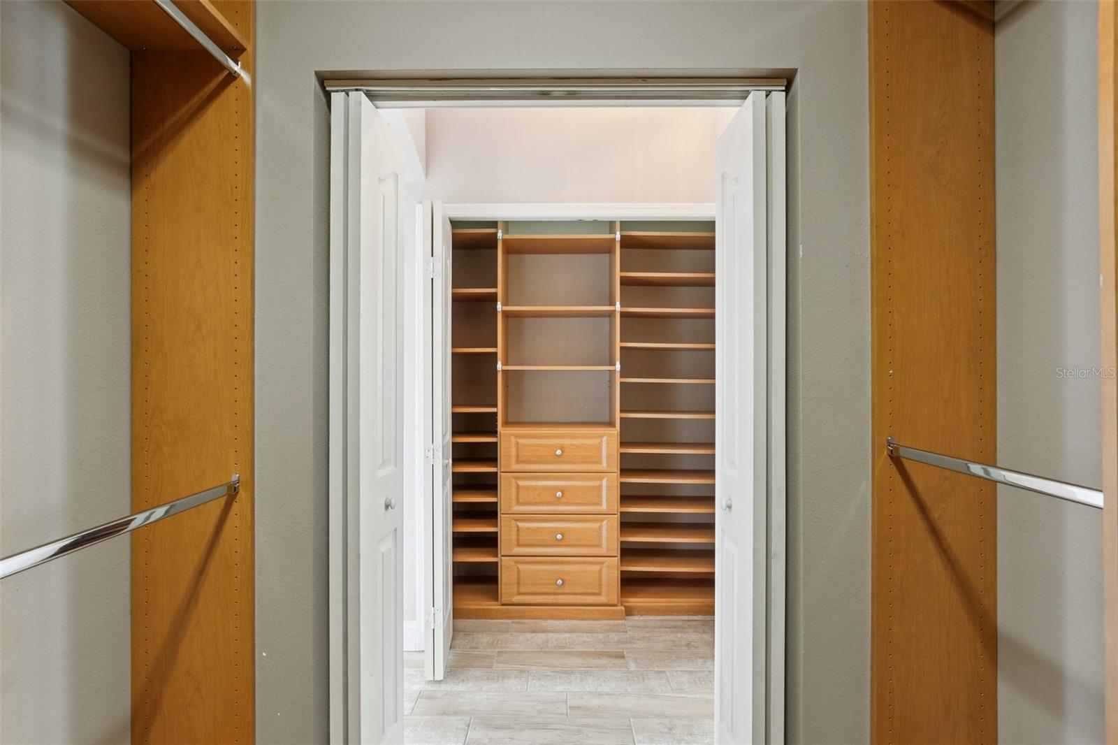BEAUTIFULLY CRAFTED MASTER CLOSET BUILT-INS!