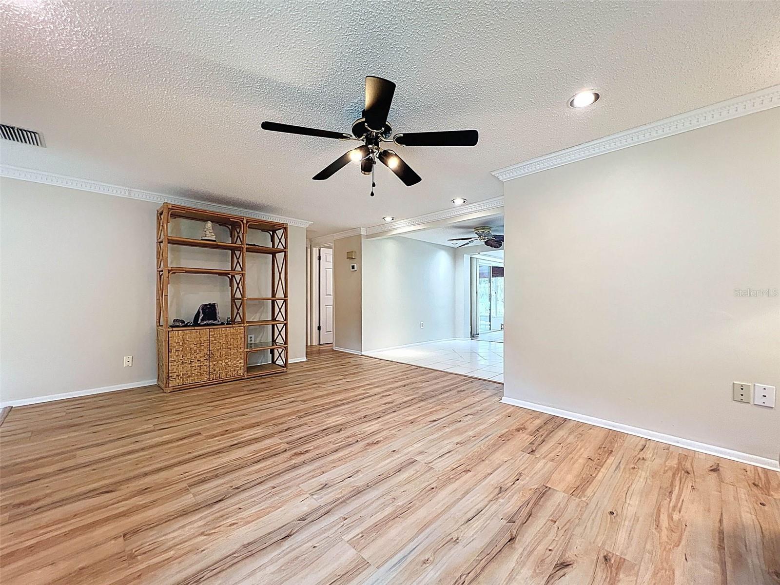 living room leads to kitchen area.