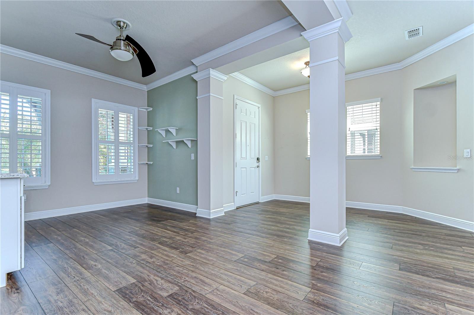 Dining Area with Plantation Shutters and Custom Built-Ins