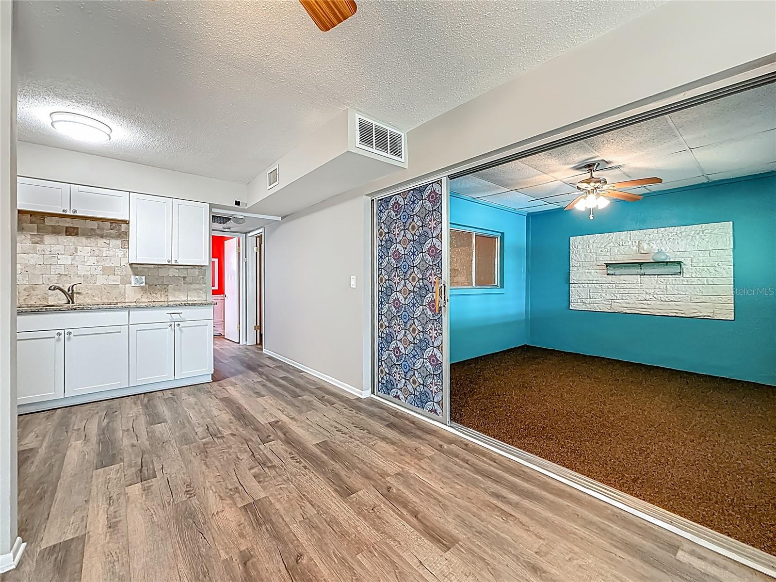 Living-Dining Room with entry to bonus room on right