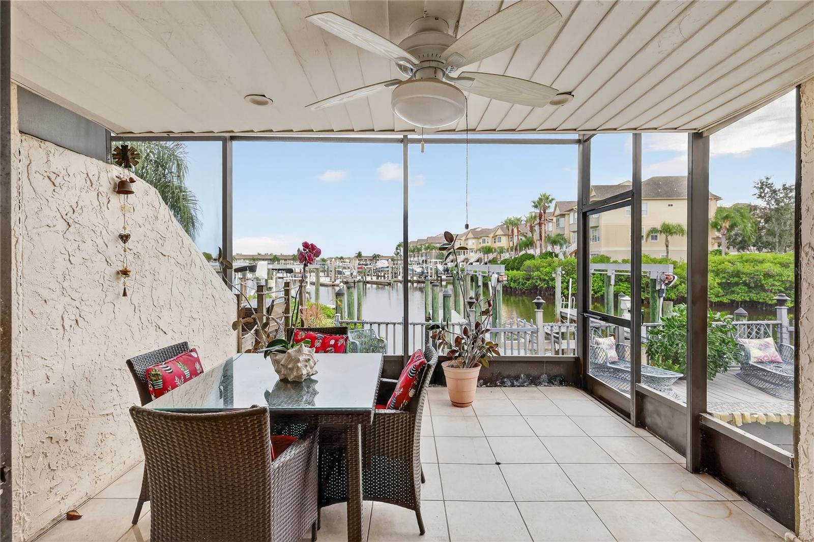 The living room has a large screened balcony.