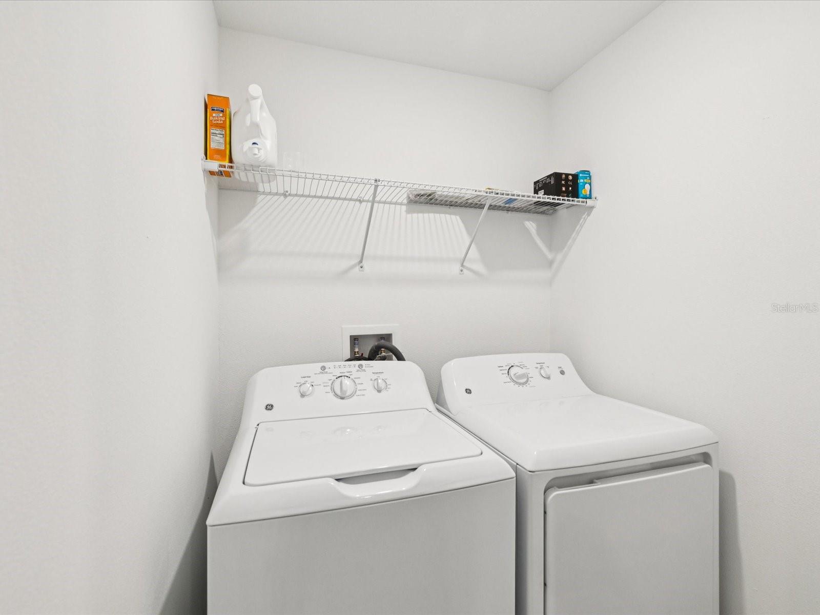 Laundry room upstairs with bedrooms