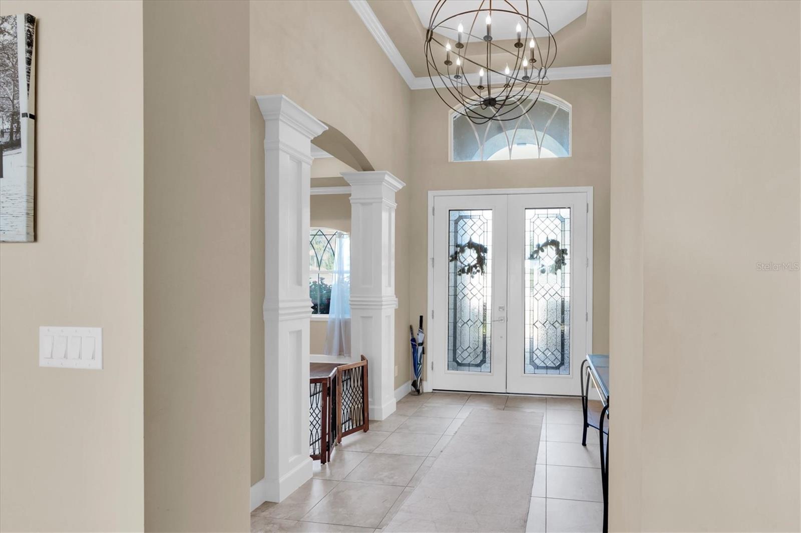 Beautifuyl entry way with restoration hardware chandelier