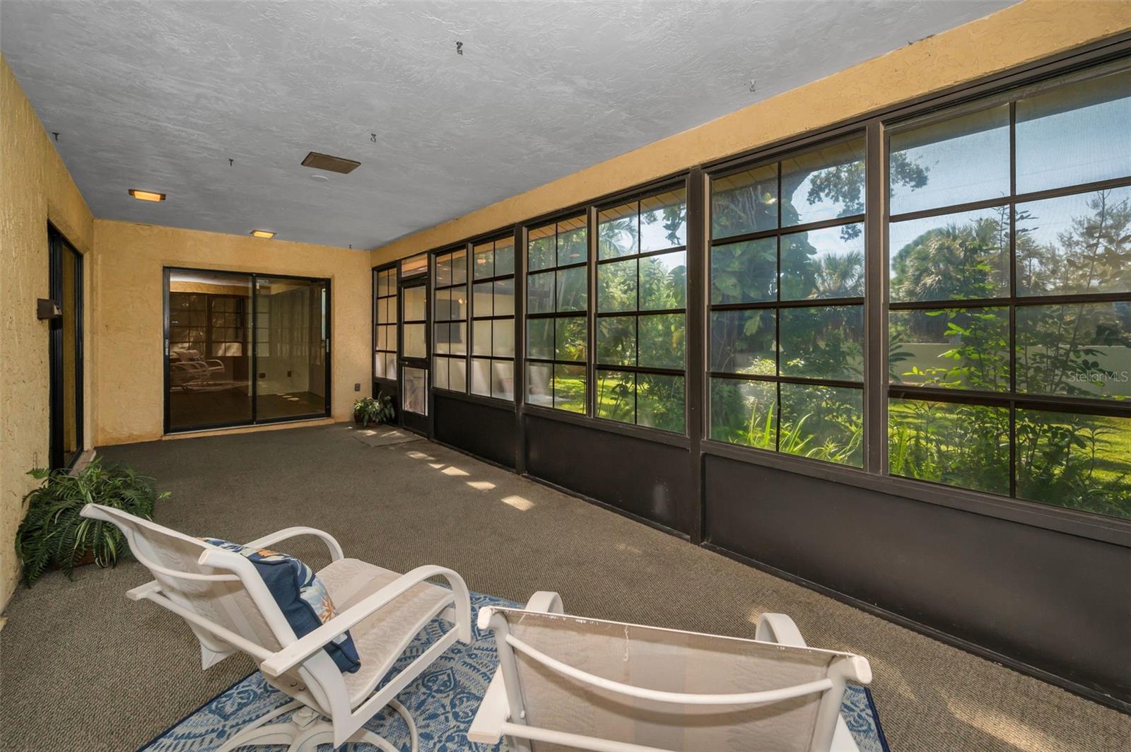 Porch-Sunroom Overlooks Patio