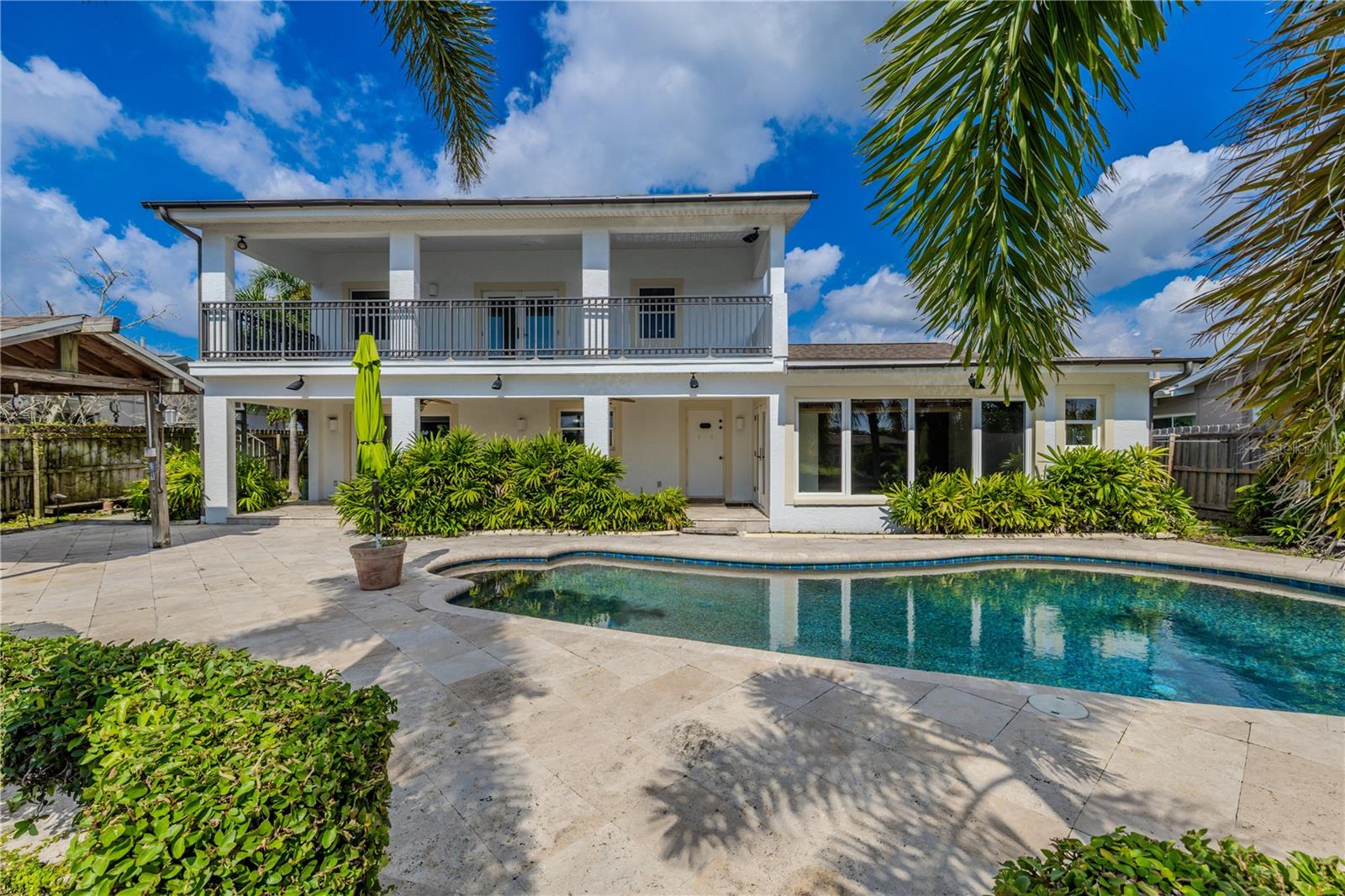 Dual-Level Outdoor LivingThis home is designed for seamless indoor-outdoor living with two expansive covered spaces. The 330 sq. ft. upper balcony offers sweeping views of the pool and canal, accessible from the second floor with plenty of room for lounging or dining. Below, a matching 330 sq. ft. covered patio provides shaded comfort right off the pool deck, complete with ceiling fans and lighting for day-to-night enjoyment.