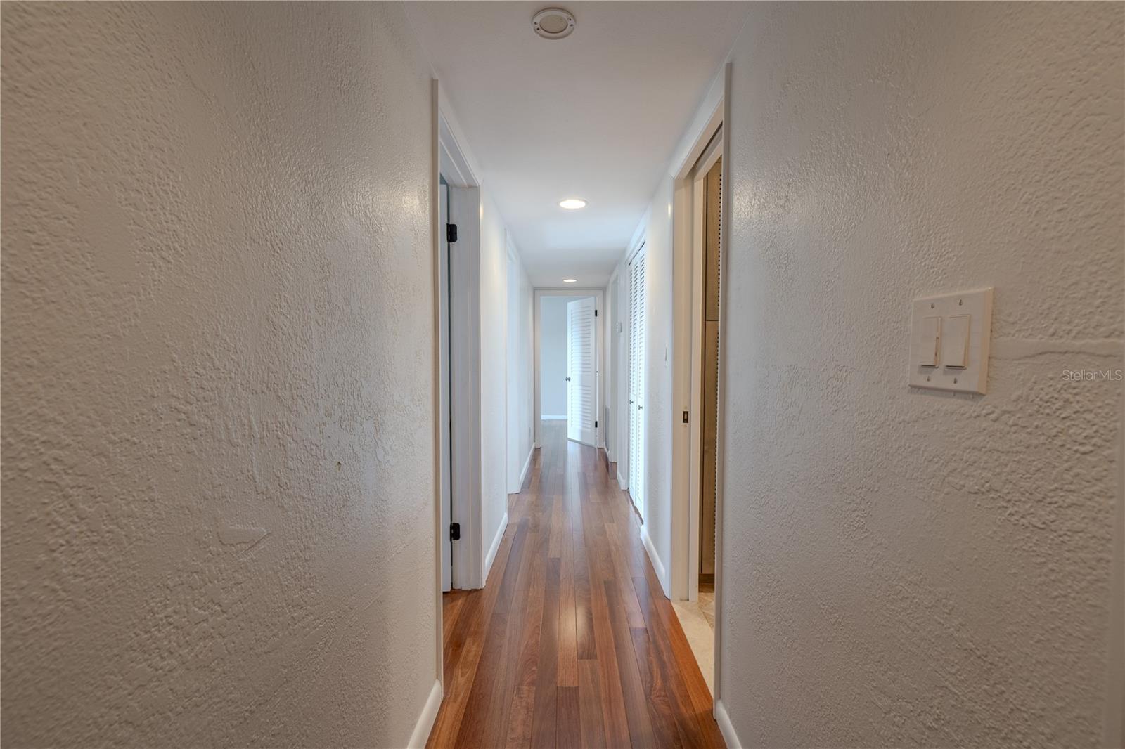 Brazilian Teak SOLID WOOD flooring in hall, bedrooms and Closets on the 2nd floor.