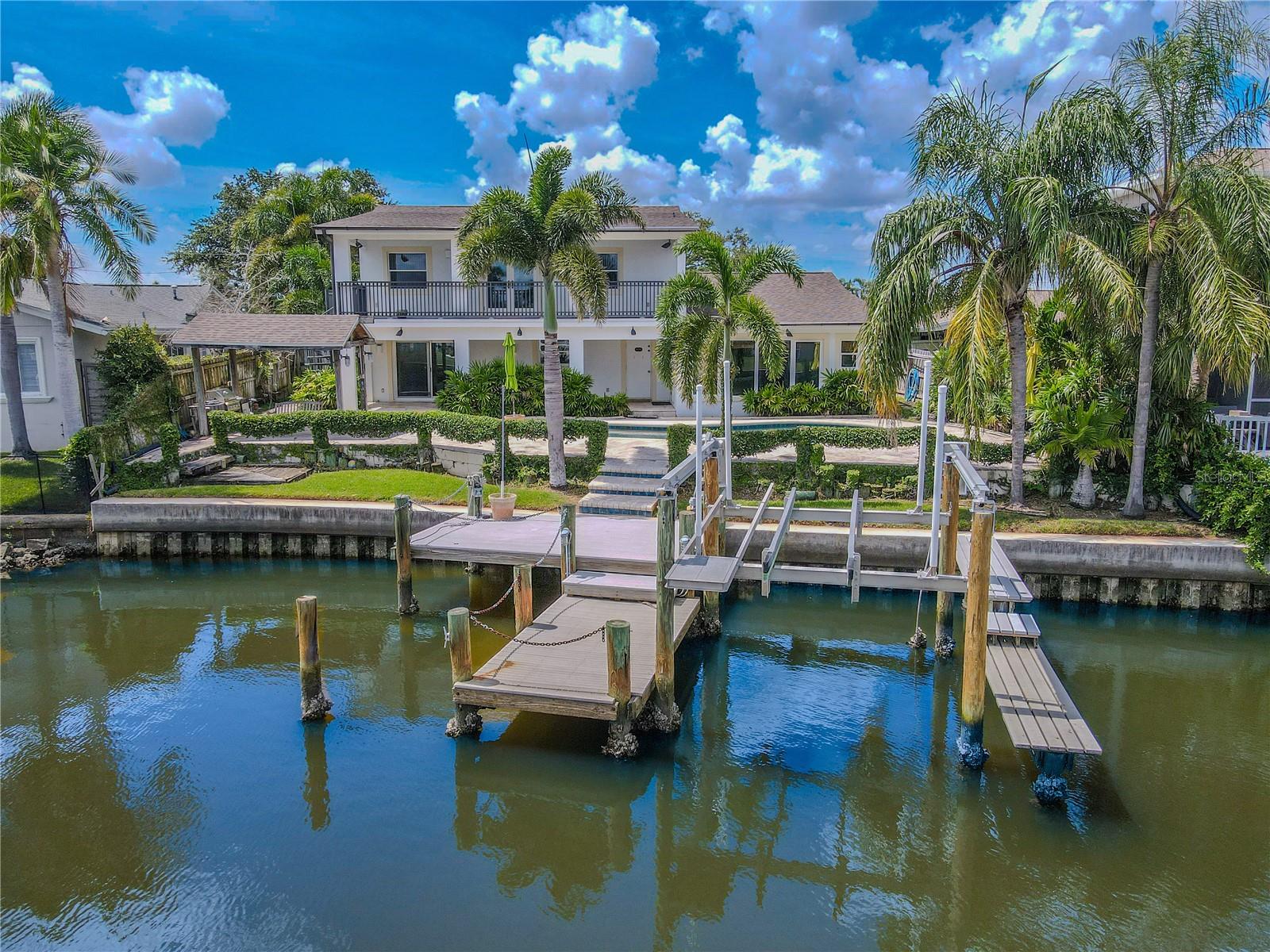 Enjoy direct canal access with a 10,000 lb. boat lift, complete with real TREX decking for durability and low maintenance. The dock is fully equipped with electric power and water connections, making it ideal for boating, fishing, or waterfront entertaining.