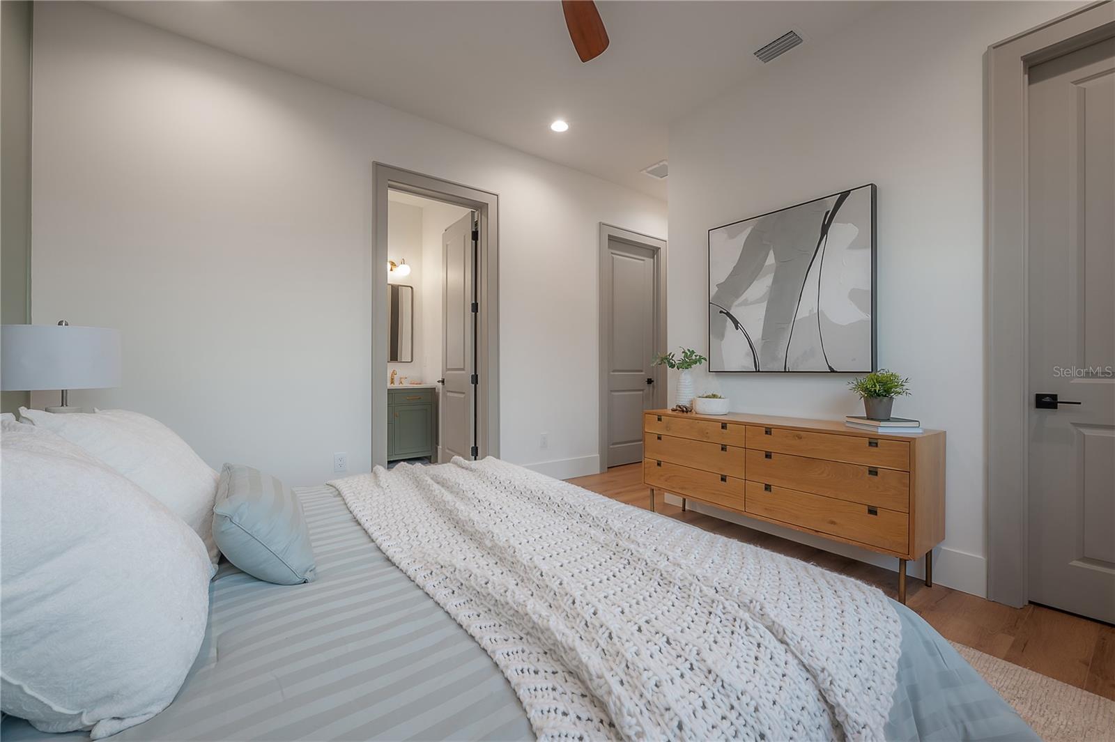 upstairs primary bedroom with dual closets