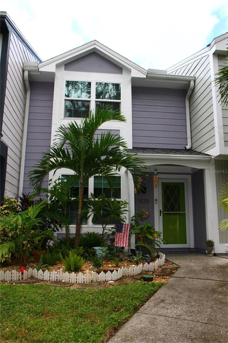 Current pic of front with additional landscaping added
