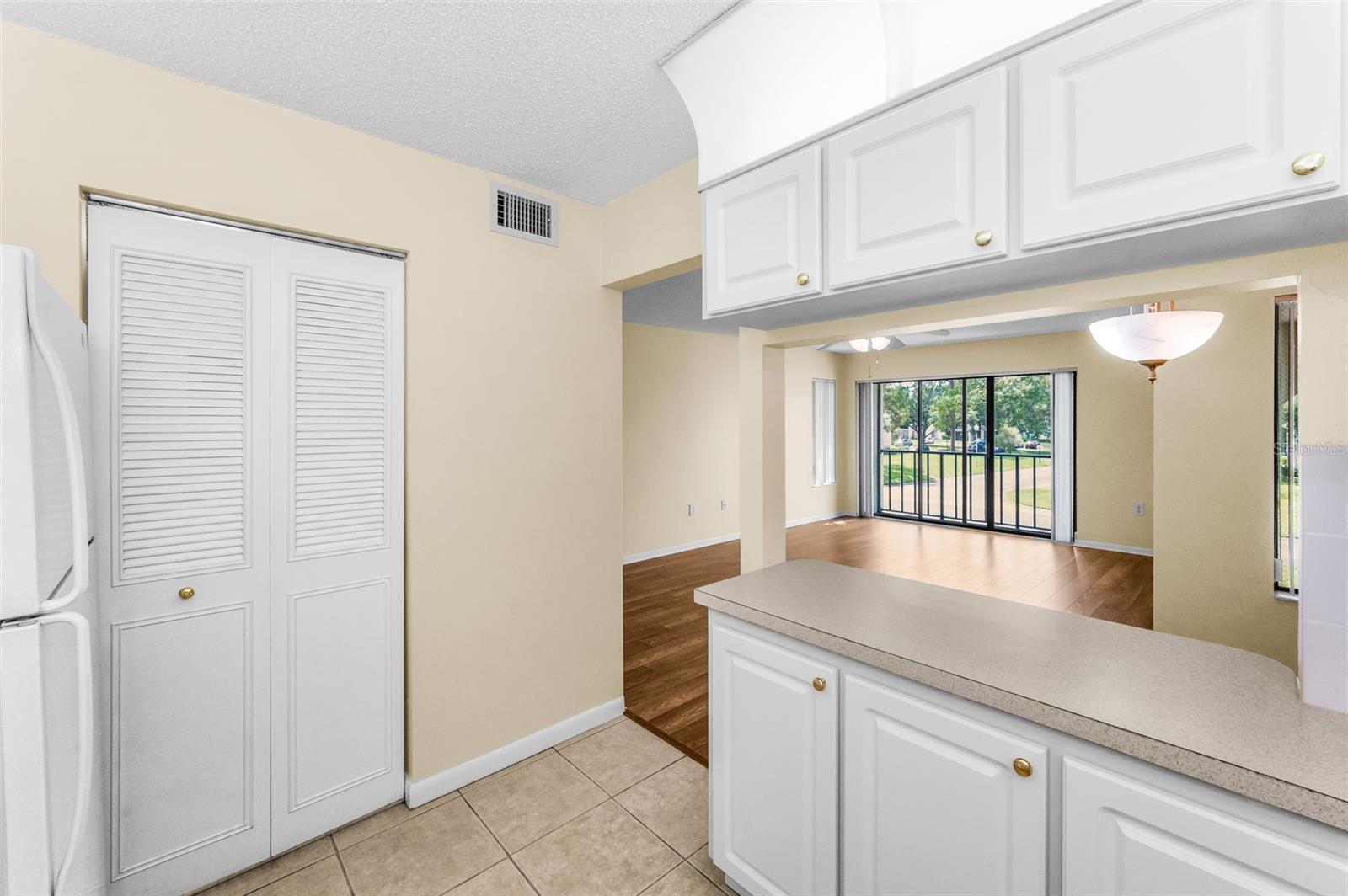 Kitchen with view of laundry closet