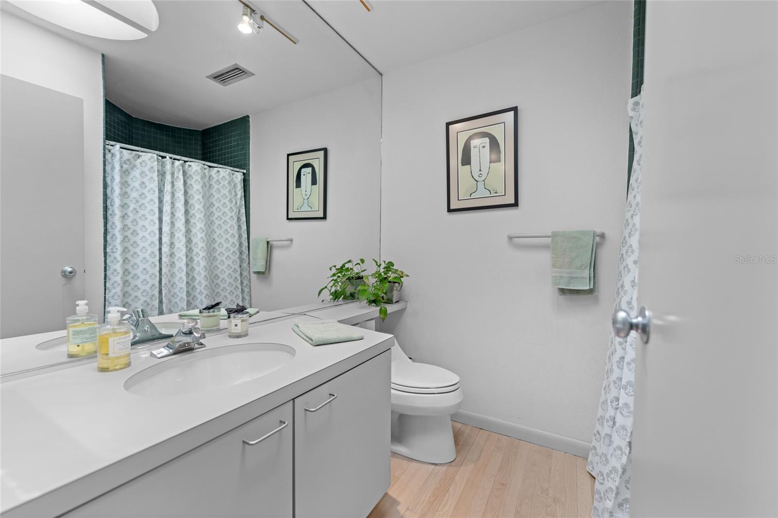 Full bath with a good amount of counter space and storage. This bathroom is conveniently located right off the office/ second bedroom