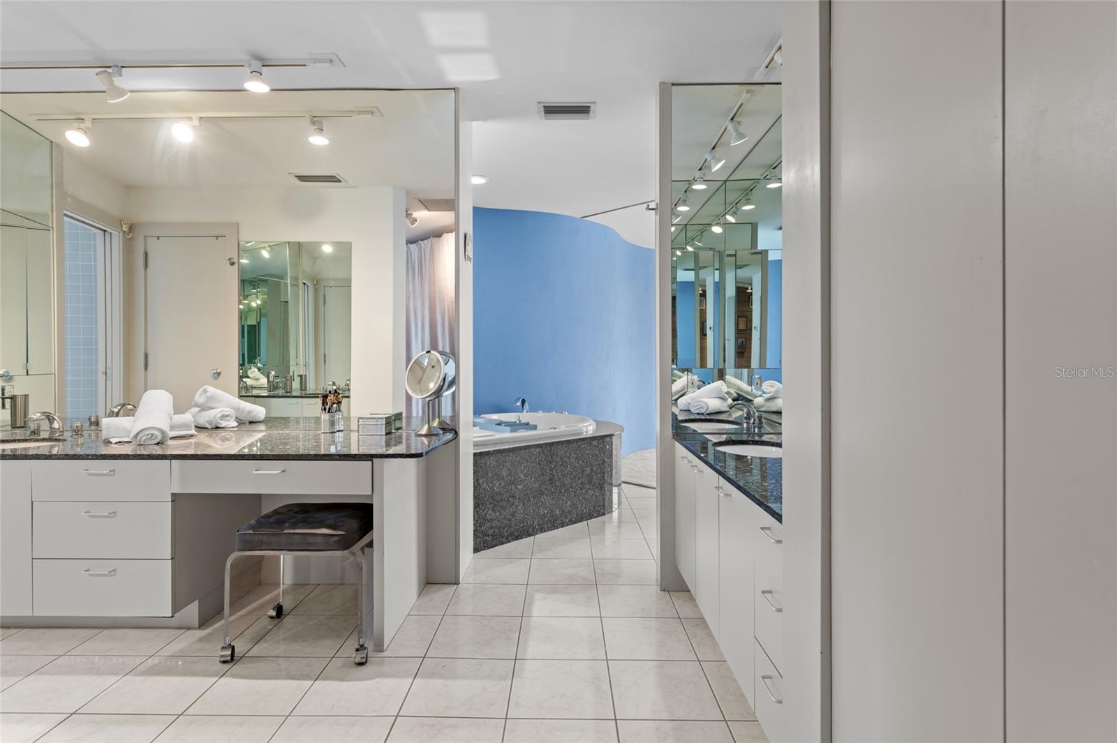 Another area of the Primary bath with separated sinks and plenty of counter space. Very functional and ready for a refresh!
