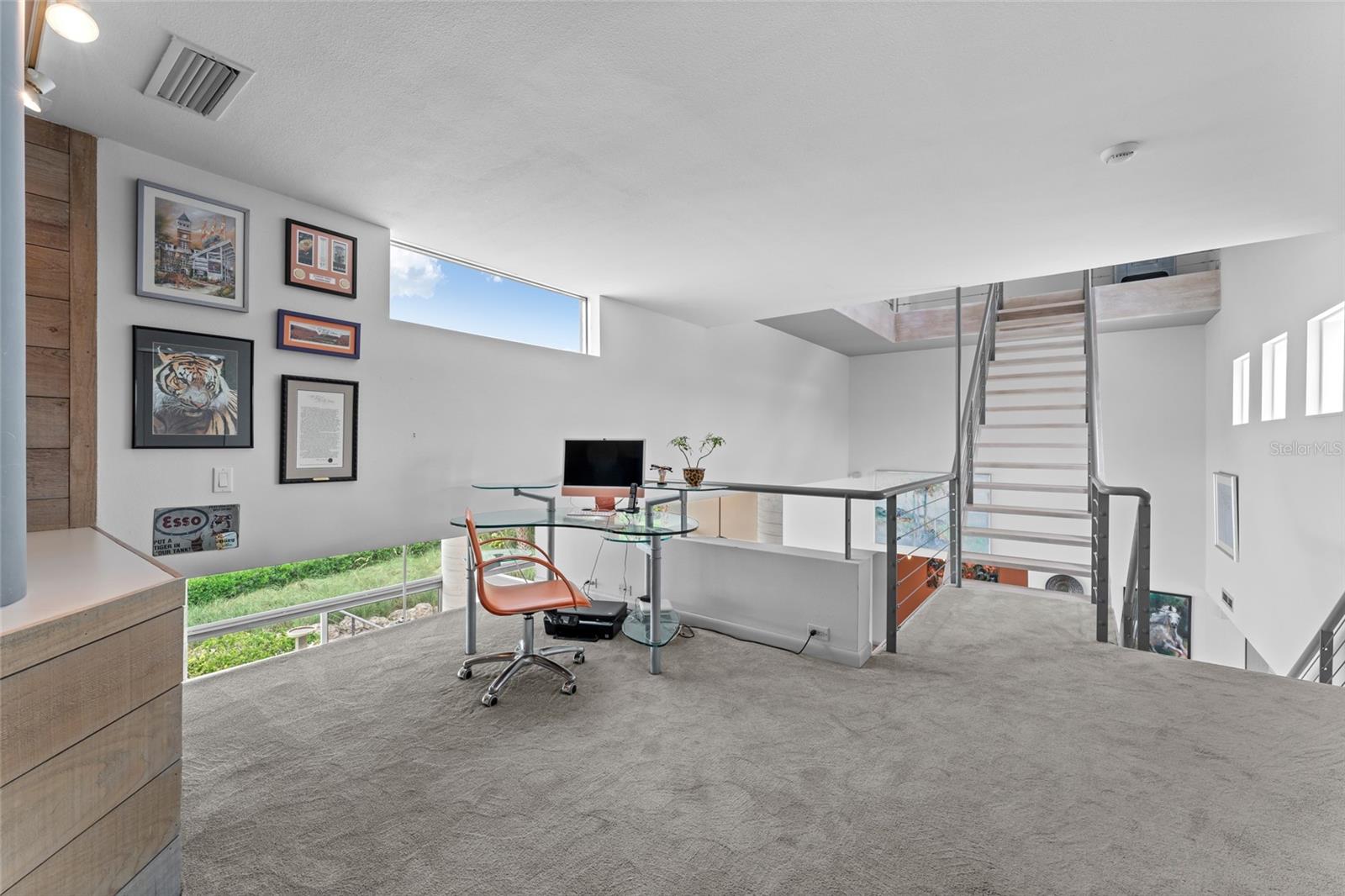 Second level loft with stairs leading to the rooftop "Sky Deck" where a bubbling hot spa awaits you!