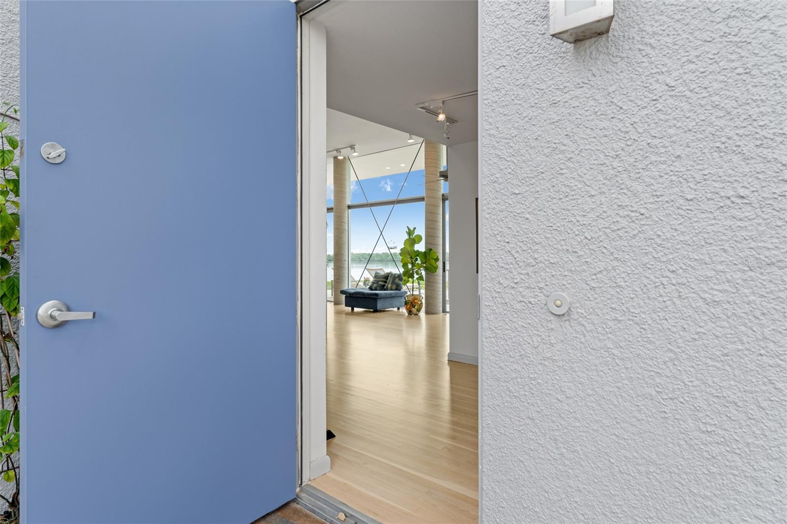 Step through the blue door and be greeted by sweeping views of Shell Island sanctuary, the Gulf of Mexico, and beyond